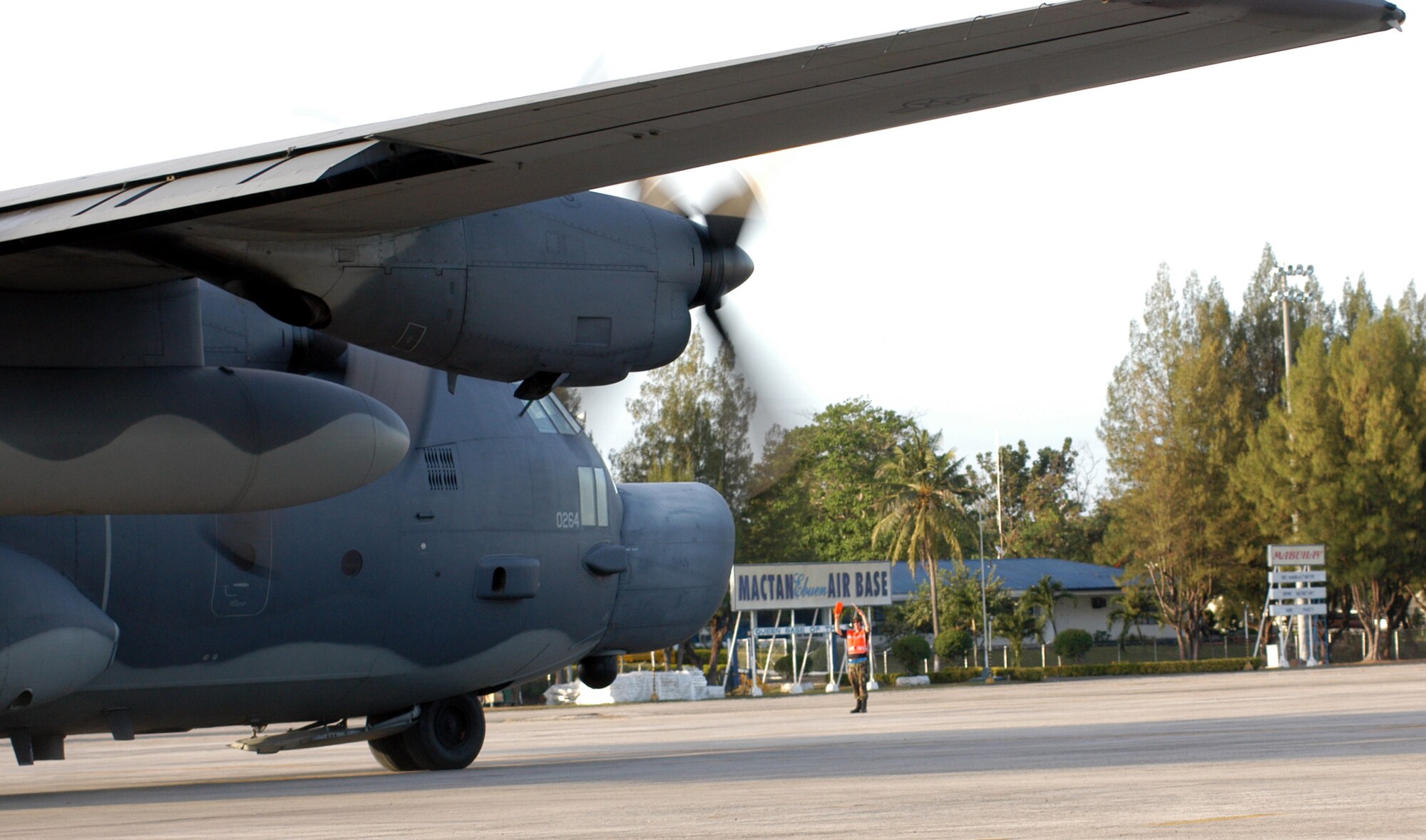 Staff Sgt. Jason Gibson, crew chief from the 353rd Maintenance Squadron, guides a Combat Talon II from the 1st Special Operations Squadron, during flight operations at Mactan Air Base, Philippines, during Balance Piston.  (USAF photo by Master Sgt. Marilyn Holliday)