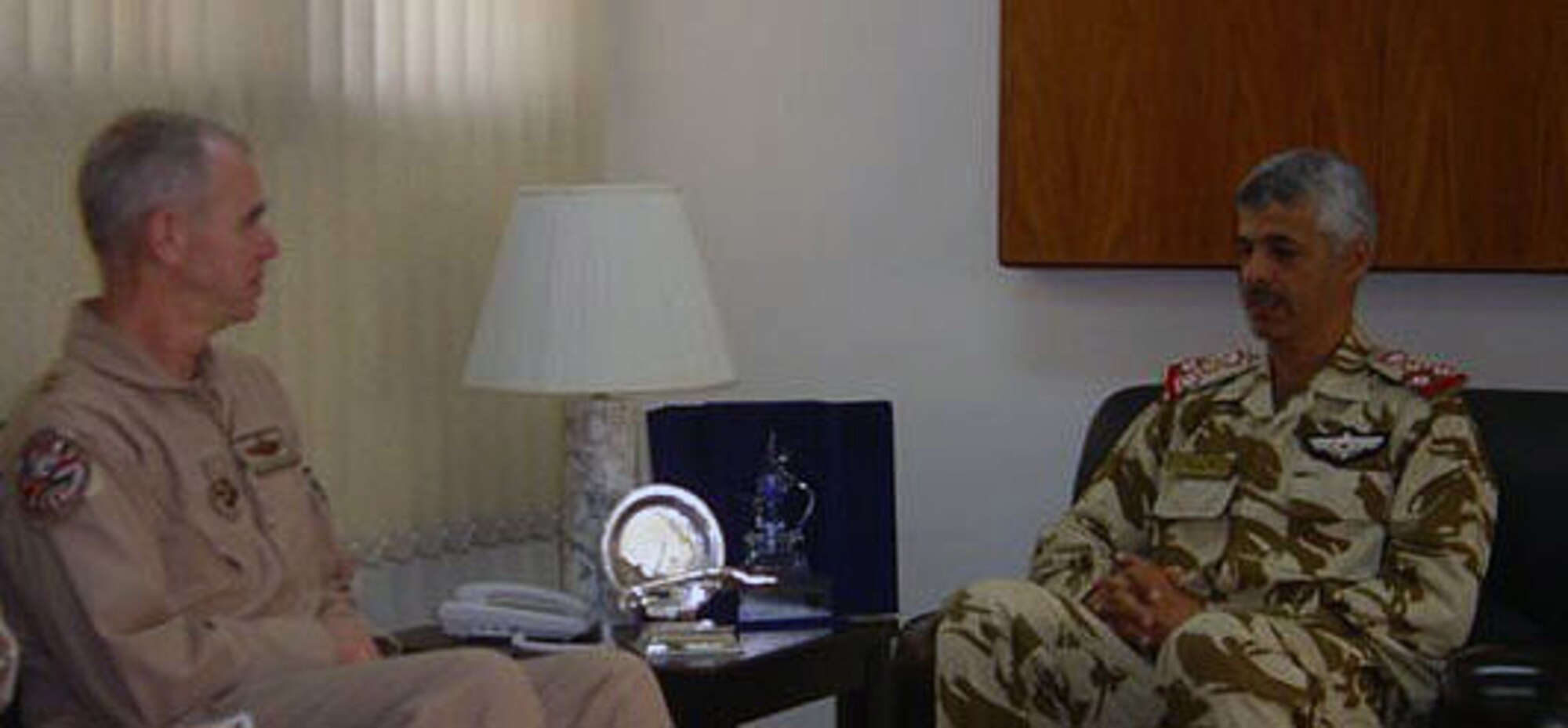 Maj. Gen. William Holland, deputy Combined Forces Air Component commander, U.S. Central Command, meets with Brig. Gen. Hamad, commander of the Royal
Bahraini Air Force this week at the Royal Bahraini Air Force headquarters at Shaikh Isa Air Base in Bahrain. The two air power officials discussed the military relations of their respective nations and air forces. General Holland and Lt. Gen. Gary North, the Combined Forces Air Component commander and commander of the U.S. Central Command Air Forces, travel frequently to foster military air power relations within the Central Command area of responsibility, to support the resolve of nations like Bahrain to defend their own air space and to effectively integrate air power employment throughout Southwest Asia. (U.S. Air Force photo)