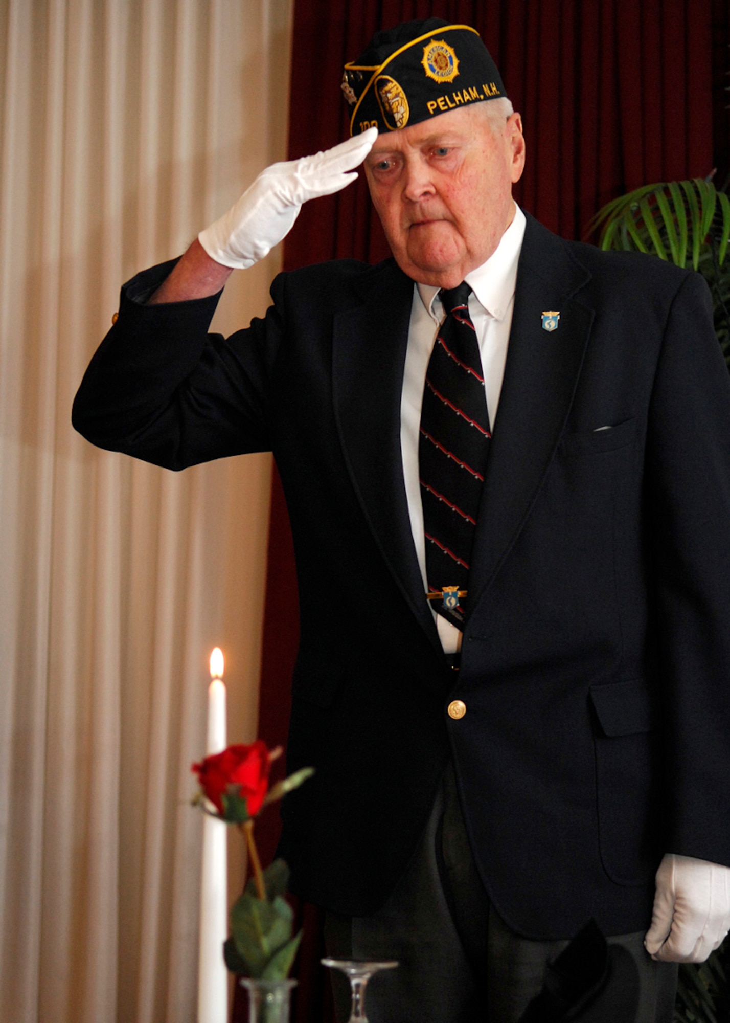Herman Hanson participates in the Prisoner of War, Missing in Action ceremony Feb. 23 at the Minuteman Club during the Honor Guard banquet. Mr. Hanson is a member of American Legion Post 48 in Hudson, N.H. The banquet recognized members of the Patriot Honor Guard as well as other area honor guard members. (US Air Force Photo by Mark Wyatt)