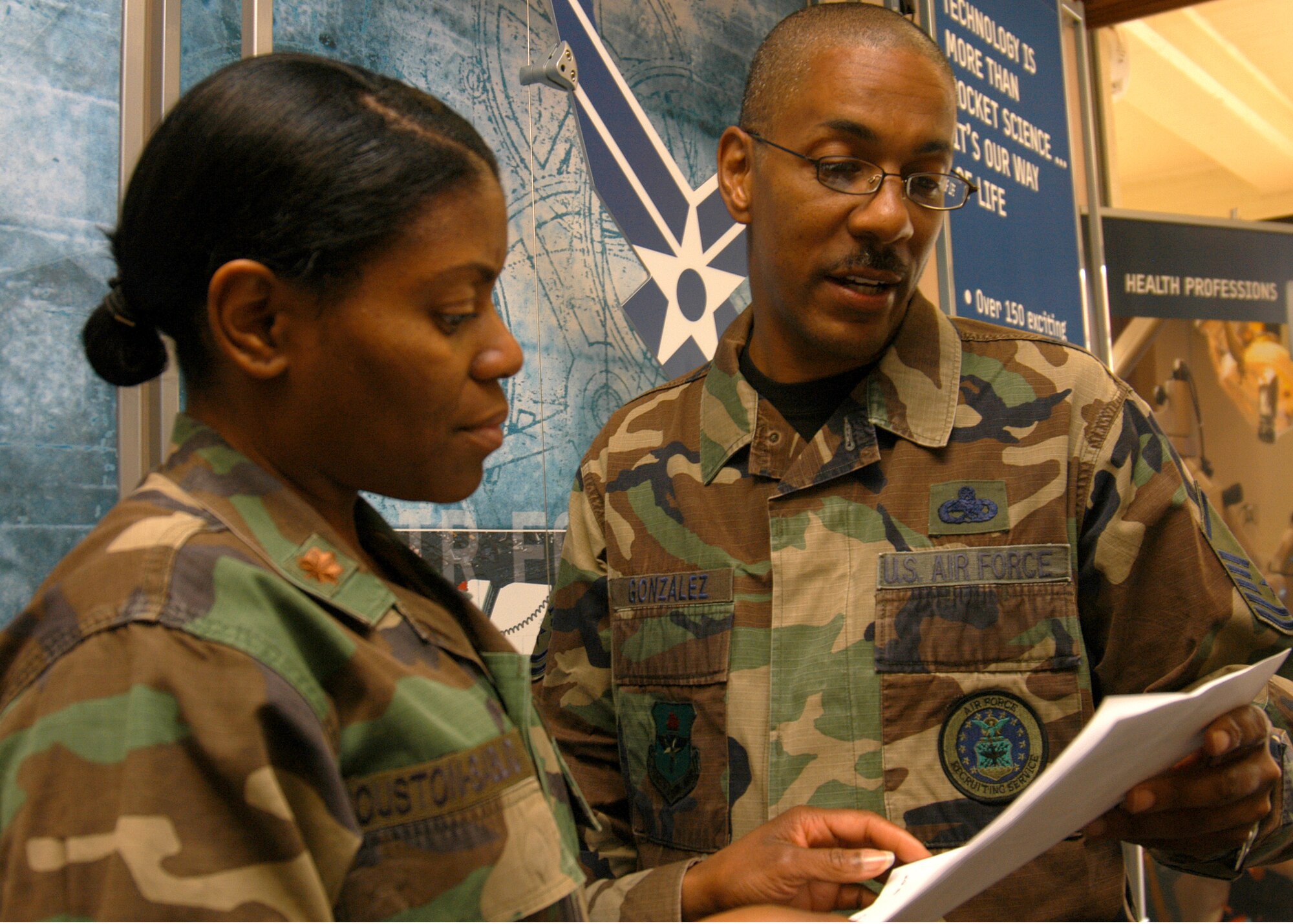 Master Sgt. Terrance Gonzalez reviews a high school tier evaluation with Maj. Kimberly Houston-Sablad, 368th Recruiting Service Operations Flight chief, during Air Force Recruiting Service’s combined Operations Flight Commander and Support Flight Commander Workshop Feb. 28 on Randolph Air Force Base, Texas. Sergeant Gonzalez, AFRS Standardization and Training Branch Operations Flight and Military Entrance Processing Station trainer, conducted the revised workshop designed to enhance the efficiency of squadron operations and support flights by showing ways the two flights can share information. (U.S. Air Force photo by Staff Sgt. Jennifer Lindsey)