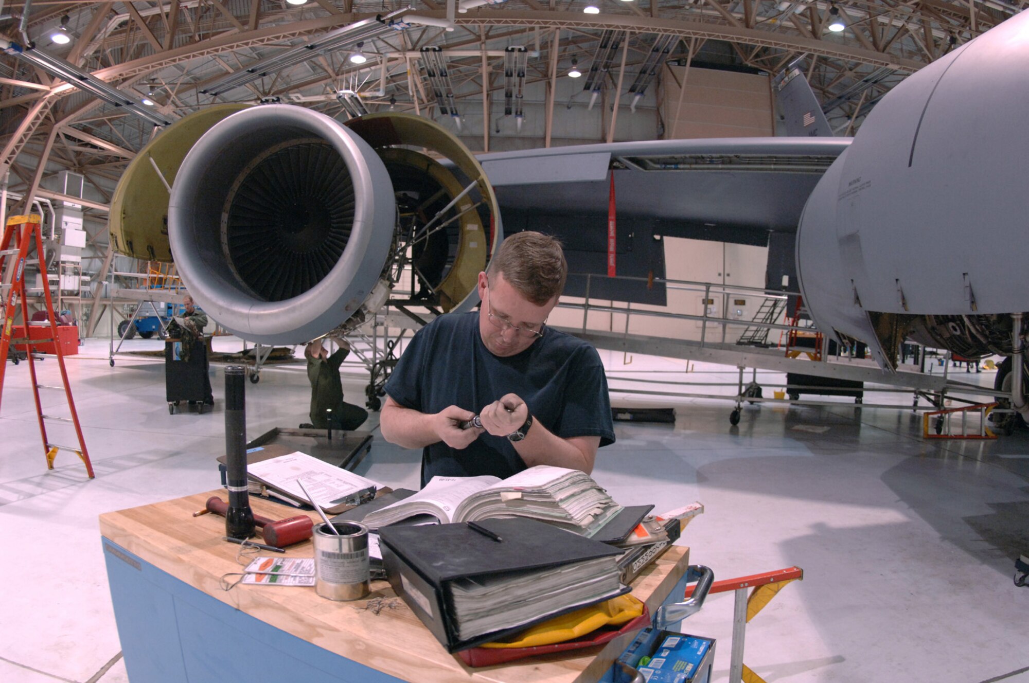 GRAND FORKS AIR FORCE BASE, N.D. – Staff Sgt. Brian O’Day, 319th Maintenance Squadron, cross references a part with reference material during a periodic inspection here, Feb. 27.  Every KC-135 goes through periodic inspections every 15 months or 1,500 flight hours.  Sergeant O’Day and more than 50 other maintenance Airmen inspect and repair nearly every system within five to eight days. (U.S. Air Force photo/Airman 1st Class Chad Kellum)