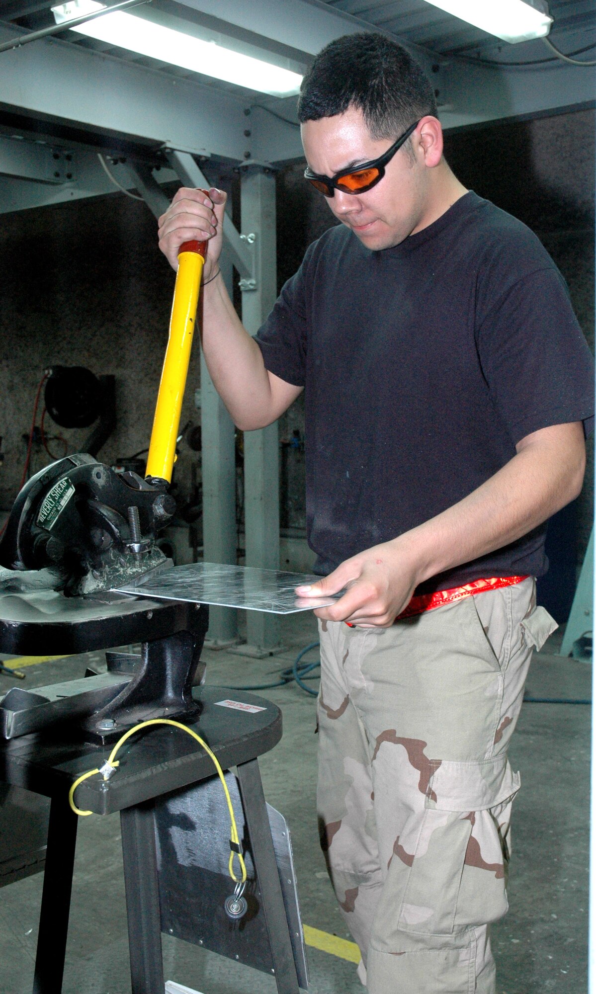 Airman 1st Class Francisco Estrada fabricates an auxiliary power unit mounting bracket Feb. 20 for the left main landing gear door of a C-130 Hercules in Southwest Asia.  Aircraft structural maintenance journeyman, such as Airman Estrada, regularly create aircraft parts that are not mass produced by manufacturers. He is deployed with the 379th Expeditionary Maintenance Squadron. (U.S. Air Force photo/Senior Airman Erik Hofmeyer)