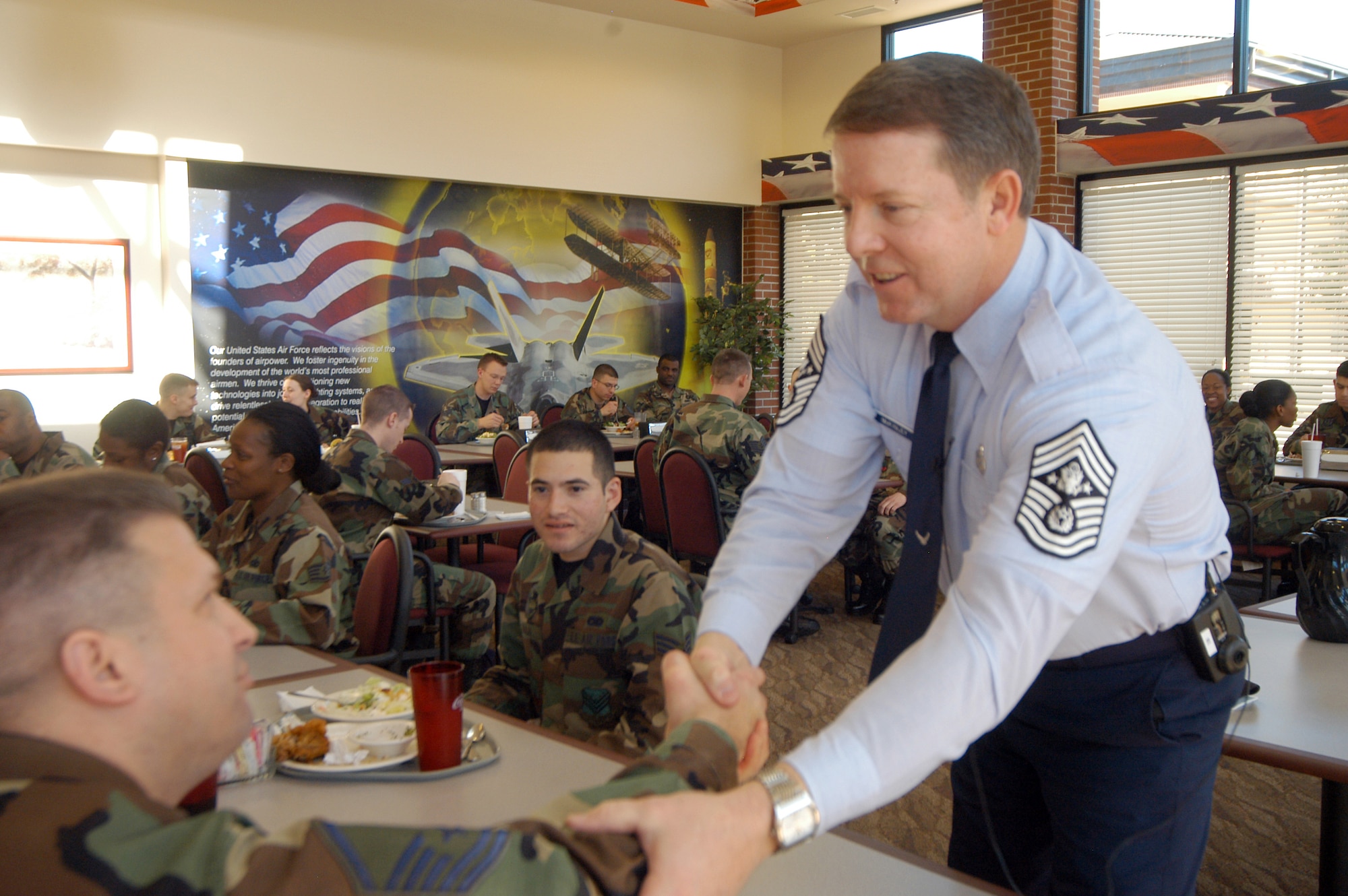 Chief Master Sgt. of the Air Force, Rodney J. McKinley, shakes hands with Airmen at a luncheon at Wynn Dining Hall Feb. 22. The chief met with Robins Airmen, offering advice and encouragement, as well as providing answers to questions and concerns regarding the future of the Air Force. U.S. Air Force photo by Sue Sapp.