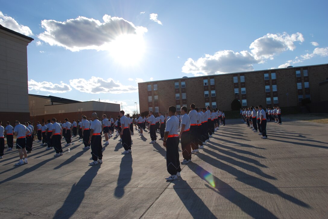 Members of the 360th Training Squadron stand ready while performing physical readiness training March 1 at Sheppard Air Force Base, Texas. The Airmen-in-training participate in PRT, consisting of 30 minutes of calisthenics and a group run among the training squadrons, outside the 360th dormitory three times a week. (U.S. Air Force photo/Airman 1st Class Jacob Corbin)