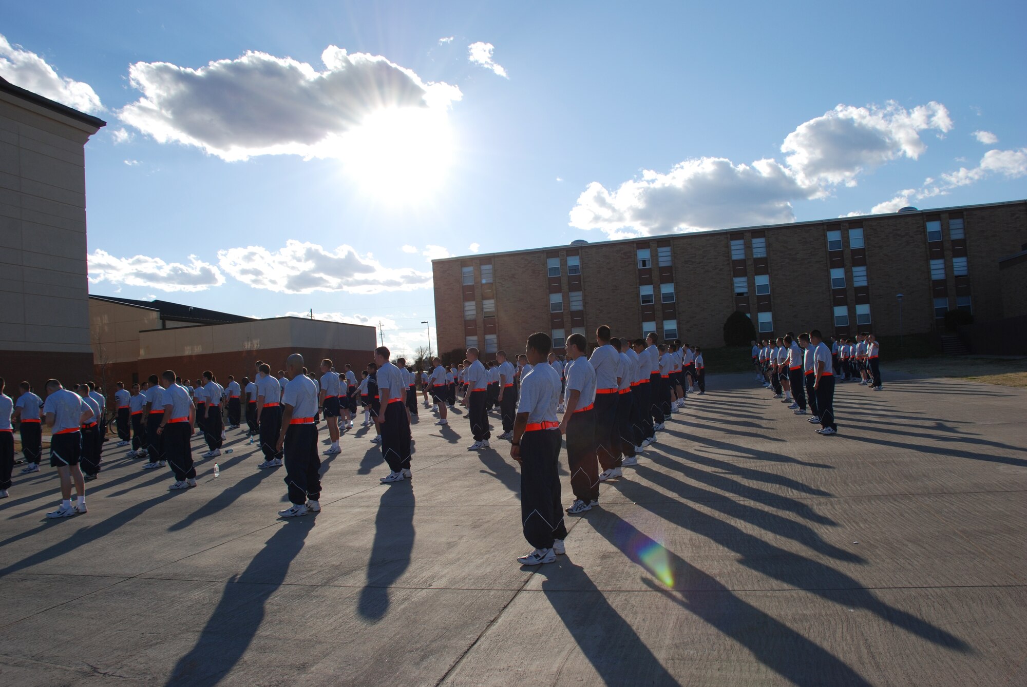 Members of the 360th Training Squadron stand ready while performing physical readiness training March 1 at Sheppard Air Force Base, Texas. The Airmen-in-training participate in PRT, consisting of 30 minutes of calisthenics and a group run among the training squadrons, outside the 360th dormitory three times a week. (U.S. Air Force photo/Airman 1st Class Jacob Corbin)