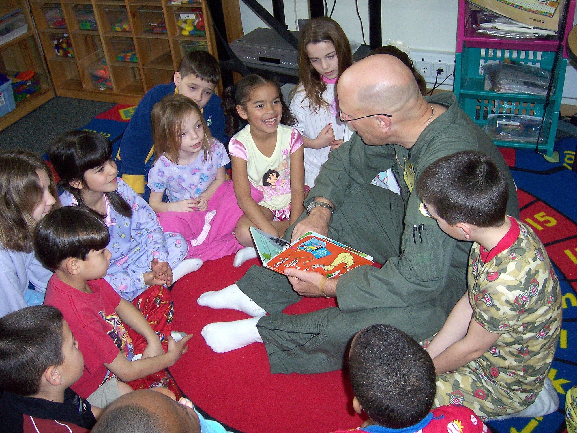 INCIRLIK AIR BASE, Turkey - Col. "Tip" Stinnette, 39th Air Base Wing commander, reads Dr. Suess' Green Eggs and Ham, to Mrs. Reddick's second grade class March 2. March 2 is Dr. Suess' birthday and is also the start of the National Education Association's Read Across America campaign. (U.S. Air Force photo by Senior Airman Tim Beckham)