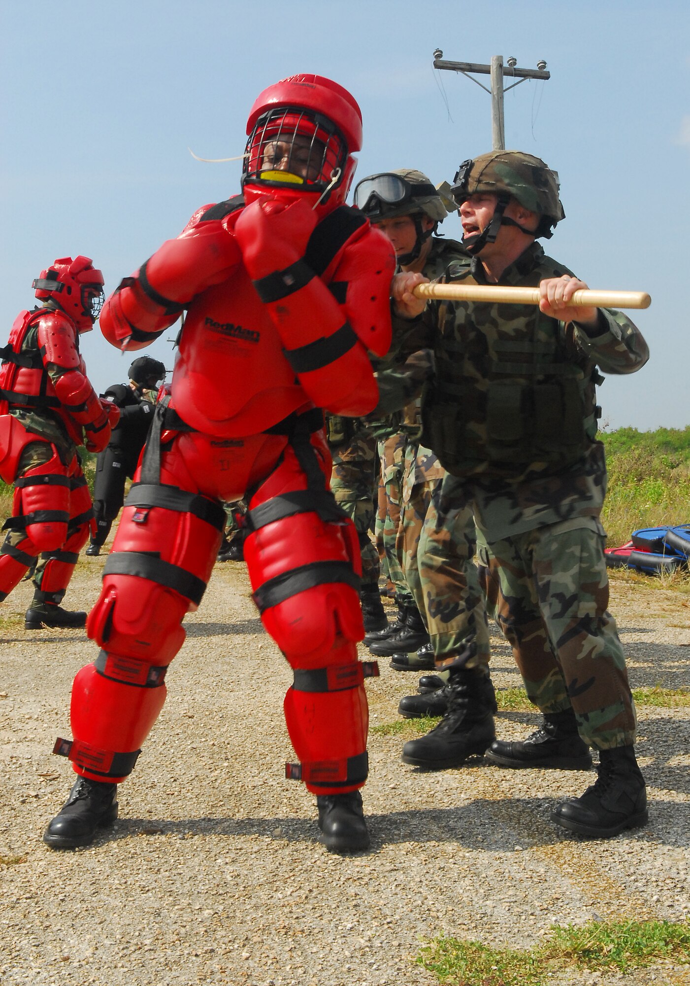 Tech. Sgt. James Glickman (right), 36th Mobility Response Squadron, and other members of the 36th Contingency Response Group exercise confrontation management techniques during the 36th CRG training at Andersen South Tuesday. The three-day exercise also conducted nighttime operations, improvised explosive devices, tactical vehicle deployment, individual movements reacting to fire, reacting to indirect or mortar fire, and self-aid and buddy care. (US Air Force photo by Airman 1st Class Daniel Owens)