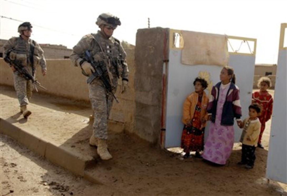 U.S. Army soldiers from 3rd Platoon, Alpha Company, 2nd Battalion, 35th Infantry Division, Schofield Barracks, Hawaii, conduct a foot patrol in Rashad village near Patrol Base Doria, Iraq, Feb. 27, 2007.