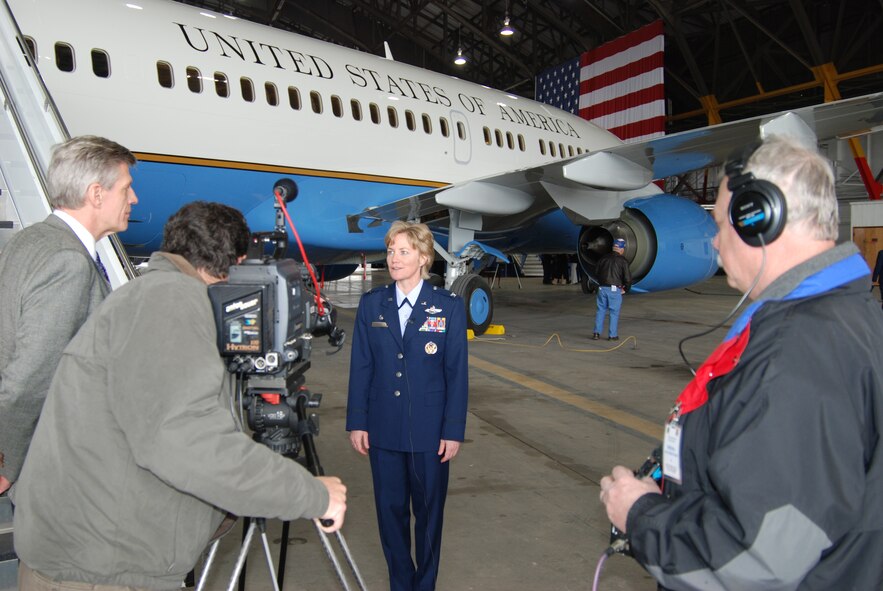 Col. Maryanne Miller, commander of the 932nd Airlift Wing, talks to video crews about a new C-40C Distinguished Visitor airplane.