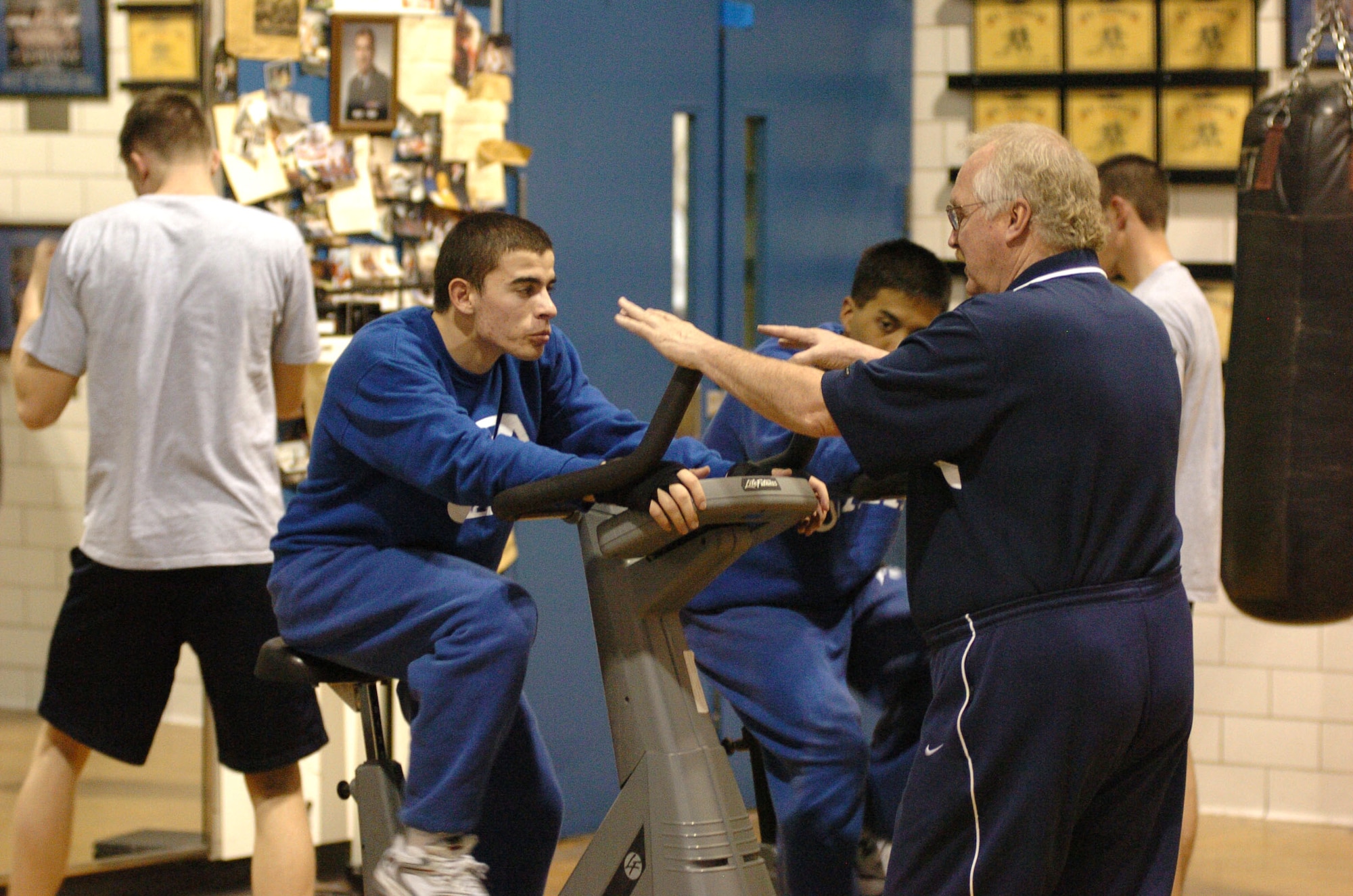 U.S. Air Force Academy boxing coach Ed Weichers Jr. talks to cadets about their upcoming fights March 2. Coach Weichers has spent more than 30 years training academy cadets the skills needed to step into the ring. His teams have never finished lower than second in the nation in the past 27 years. (U.S. Air Force photo/1st Lt. John Ross)
