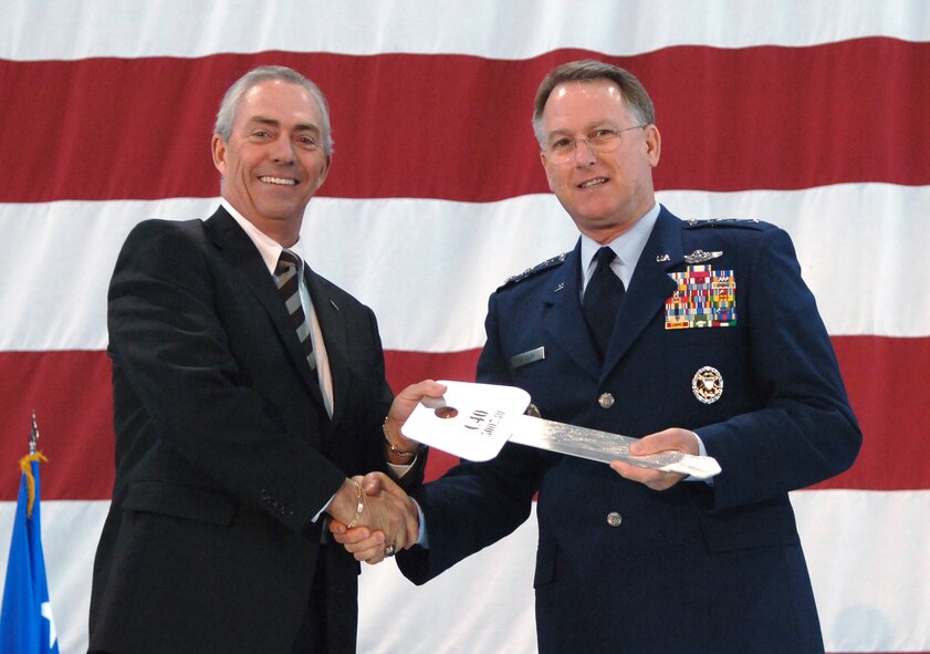 RIGHT:  Lt. Gen. John Bradley, Commander, Air Force Reserve Command, receives a "key" to the C-40C aircraft from Ronald Marcotte, Vice President and General Manager, Global Mobility Systems, Boeing Integrated Defense Systems on February 26, 2007.
