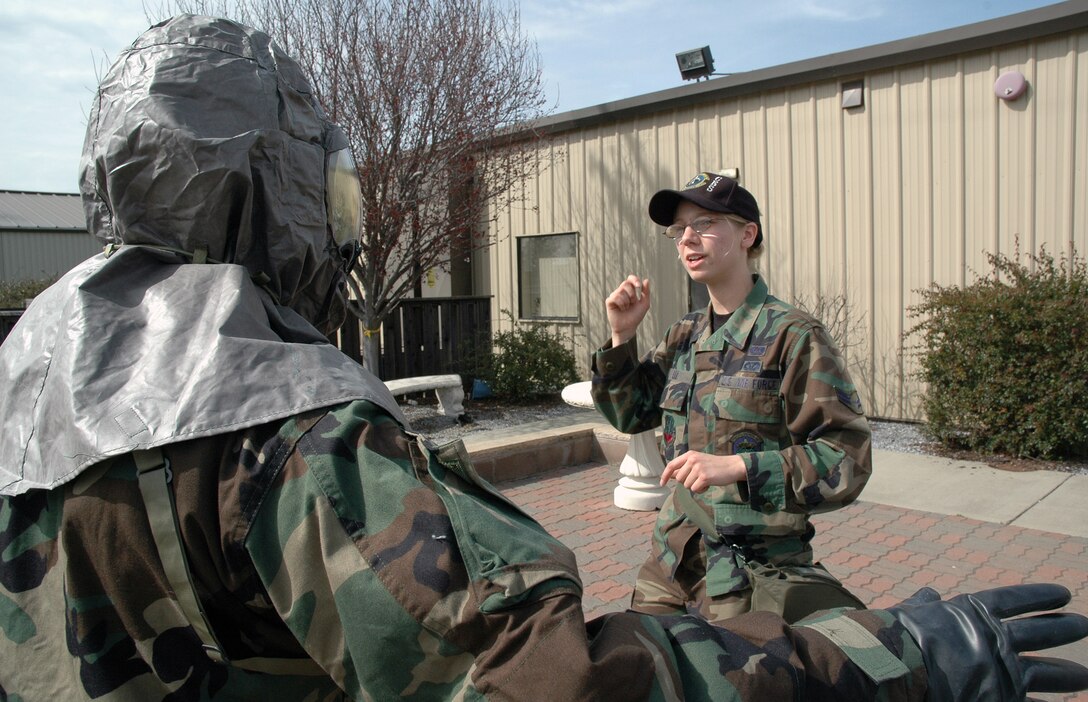 BEALE AIR FORCE BASE, Calif.- Airman 1st Class Katie Lee a readiness instructor from the 9th Reconnaissance Wing Civil Engineer Squadron instructs a Reservist from the 940th Air Refueling Wing in the proper use of chemical protective gear during a Unit Training Assembly March 4, 2007 at Beale Air Force Base, Calif. Air Force Reservists are required to maintain the same level of readiness as their active duty counterparts.
(U.S. Air Force Photo/ Staff Sgt. Luke Johnson)