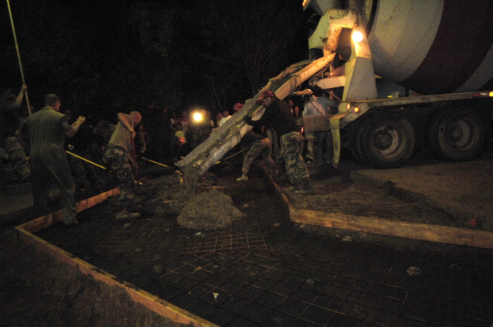 Airmen deployed with 820th Expeditionary Red Horse Squadron pour concrete March 2 for a new roadway in Santa Teresa, Nicaragua.  The effort was part of New Horizons-Nicaragua 2007, a $7.25 million joint U.S. and Nicaraguan military humanitarian and training exercise, providing a new school, and medical clinic, as well as free health and veterinary care, giving aid and strengthening bonds between the two nations.  (U.S. Air Force photo/Tech. Sgt. Kevin P. Milliken)
