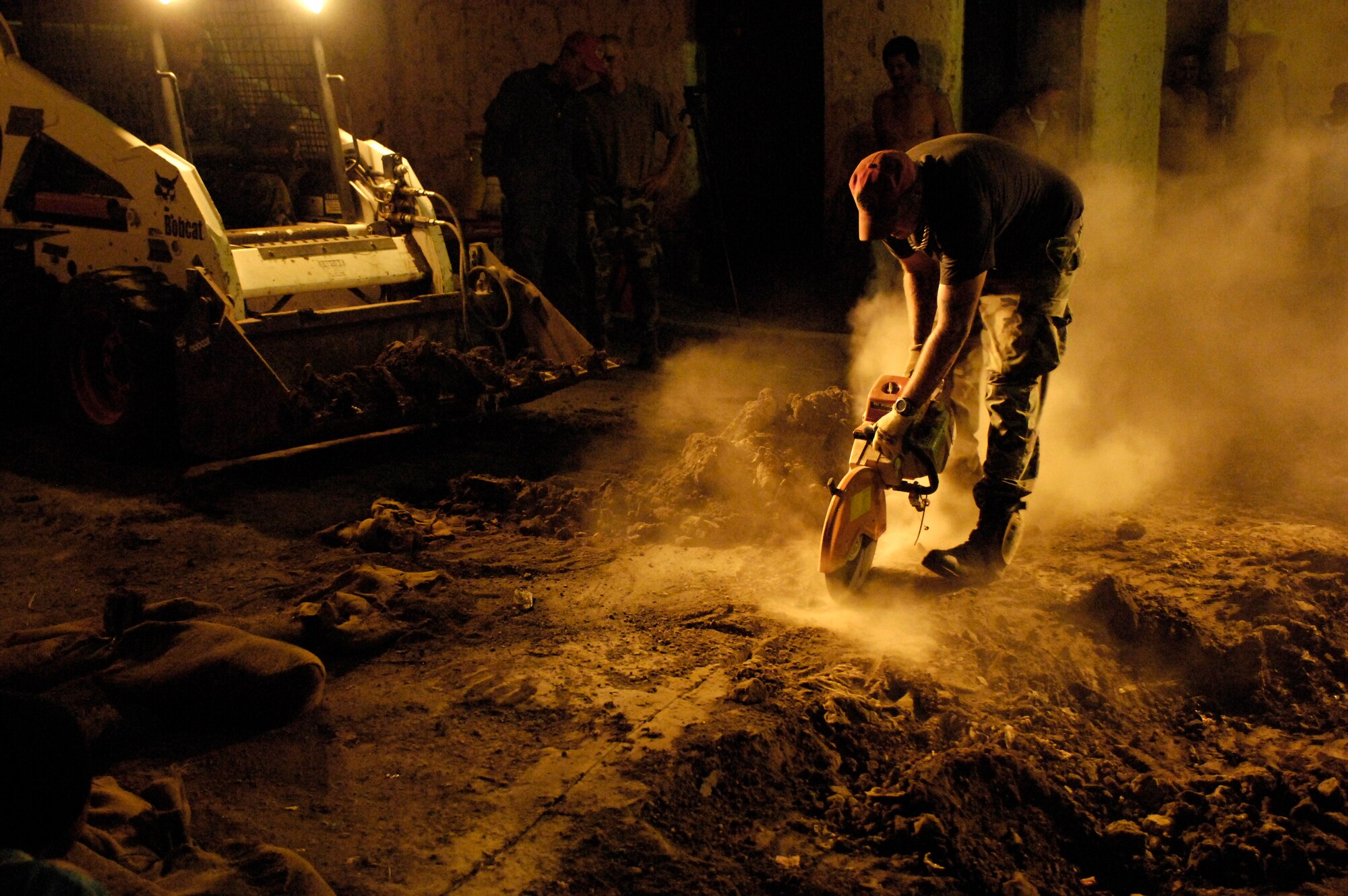 Staff Sgt. Brian Vaden cuts through the surface of an old road March 2 in Santa Teresa, Nicaragua, in preparation to replace the roadway. The effort was part of New Horizons-Nicaragua 2007, a $7.25 million joint U.S. and Nicaraguan military humanitarian and training exercise, providing a new school and medical clinic, as well as free health and veterinary care, giving aid and strengthening bonds between the two nations. Sergeant Vaden is deployed with 820th Expeditionary Red Horse Squadron.  (U.S. Air Force photo/Tech. Sgt. Kevin P. Milliken)