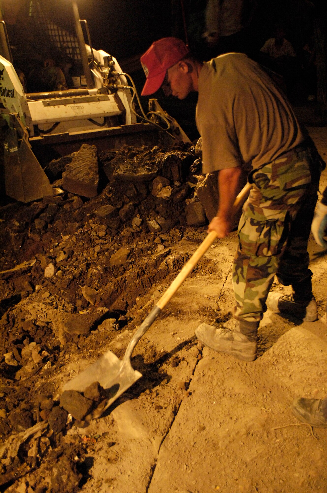 Senior Airman Damon Bessimer removes debris March 2 during a roadway repair project in Santa Teresa, Nicaragua.  The effort was part of New Horizons-Nicaragua 2007, a $7.25 million joint U.S. and Nicaraguan military humanitarian and training exercise, providing a new school, and medical clinic, as well as free health and veterinary care, giving aid and strengthening bonds between the two nations.  Airman Bessimer is deployed with the 820th Expeditionary Red Horse Squadron.  (U.S. Air Force photo/Tech. Sgt. Kevin P. Milliken)