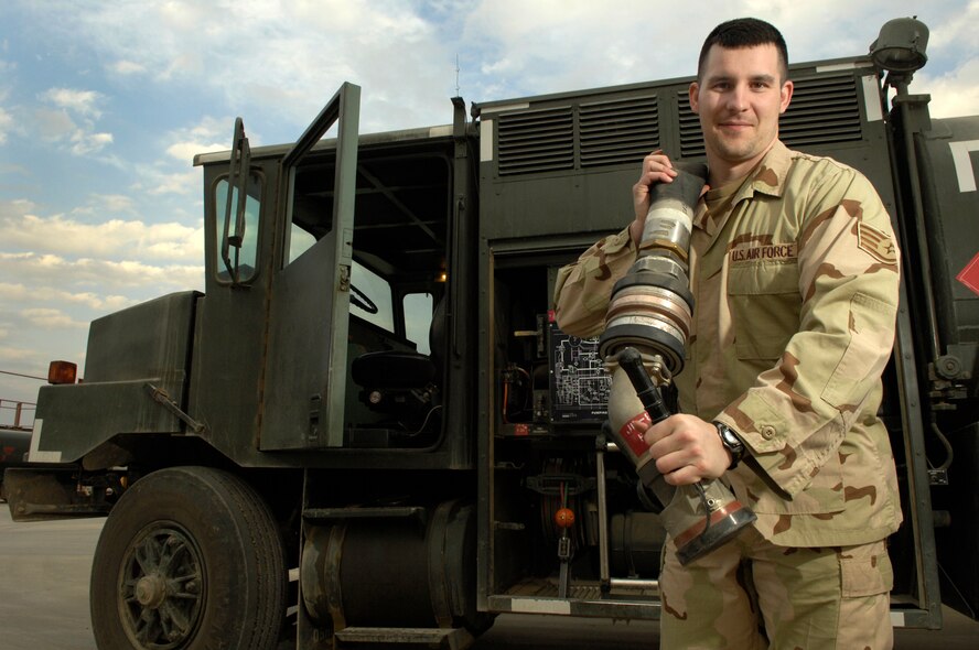 BALAD AIR BASE, Iraq -- Staff Sgt. Chad Warren, 332nd Expeditionary Logistics Readiness Squadron noncommissioned officer in charge of the fuels control center, sets up the R-11 aircraft refueling tank truck for operations Feb. 13 at Balad Air Base, Iraq. Sergeant Warren is deployed from Minot Air Force Base, N.D. Airmen with the petroleum, oil and lubricant flight recently received and issued a record-breaking 3.6 million gallons of fuel by tank truck and R-11 refueling units to every type of aircraft that touched down here in January. (U.S. Air Force photo by Airman 1st Class Nathan Doza)