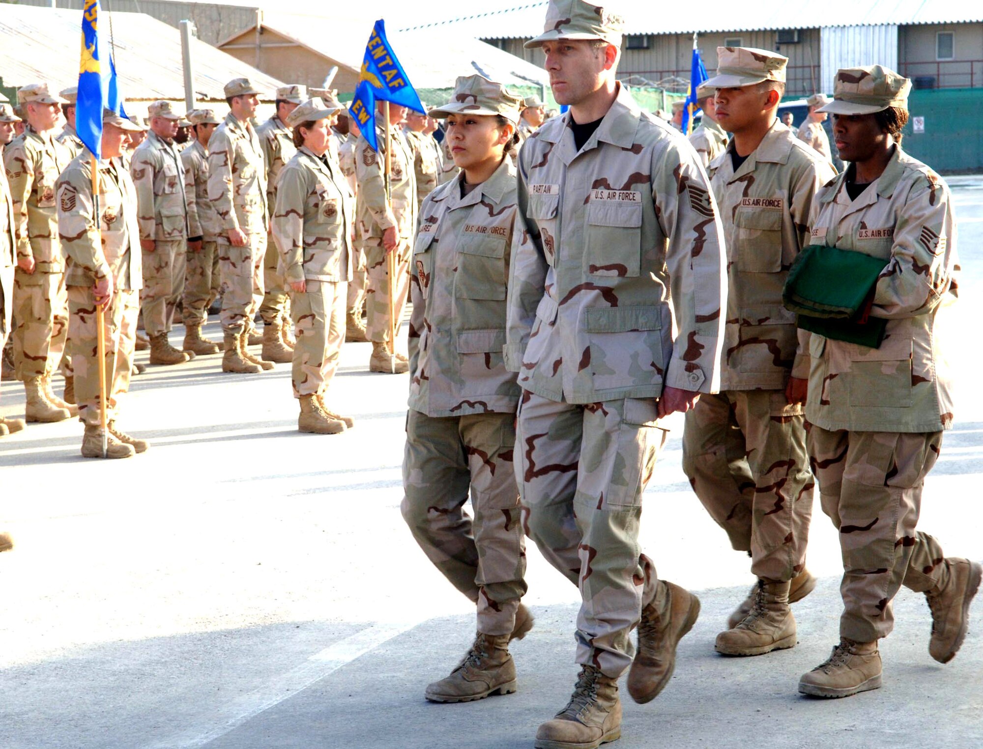 Honor guard members from the 455th Air Expeditionary Wing retire the Afghanistan flag during a formal retreat ceremony March 4 at Bagram Airfield. The retreat was held in honor of the 20 Airmen who have died in Afghanistan since Operation Enduring Freedom began in 2001. (U.S. Air Force photo/Capt. Travis B. Tougaw) 

