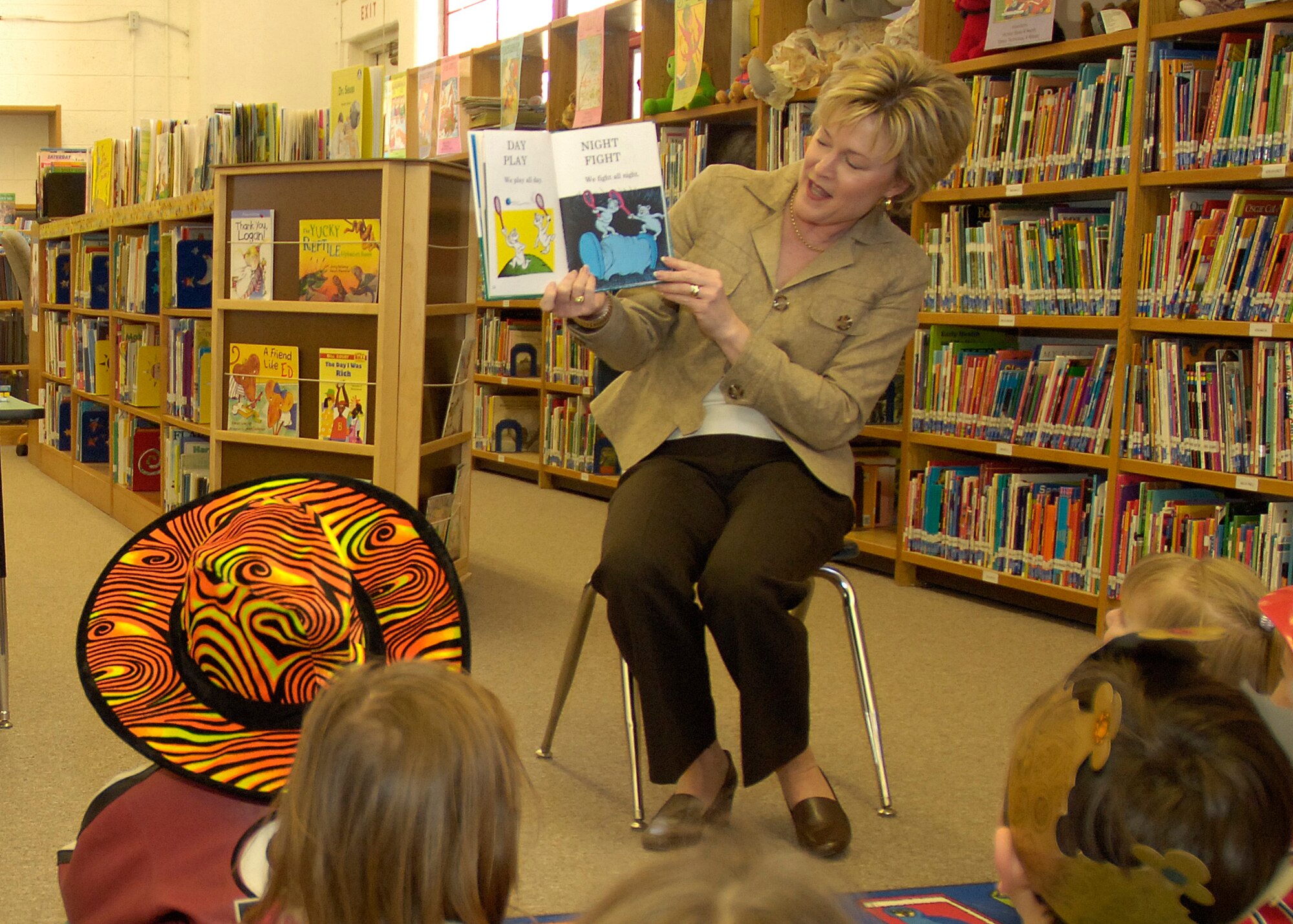 Mrs. Dawn Goldfein, 49th Fighter Wing commander's spouse, reads a Dr. Suess book to Holloman children in celebration of Dr. Suess' birthday March 2. (U.S. Air Force photo by Airman Michael Means)