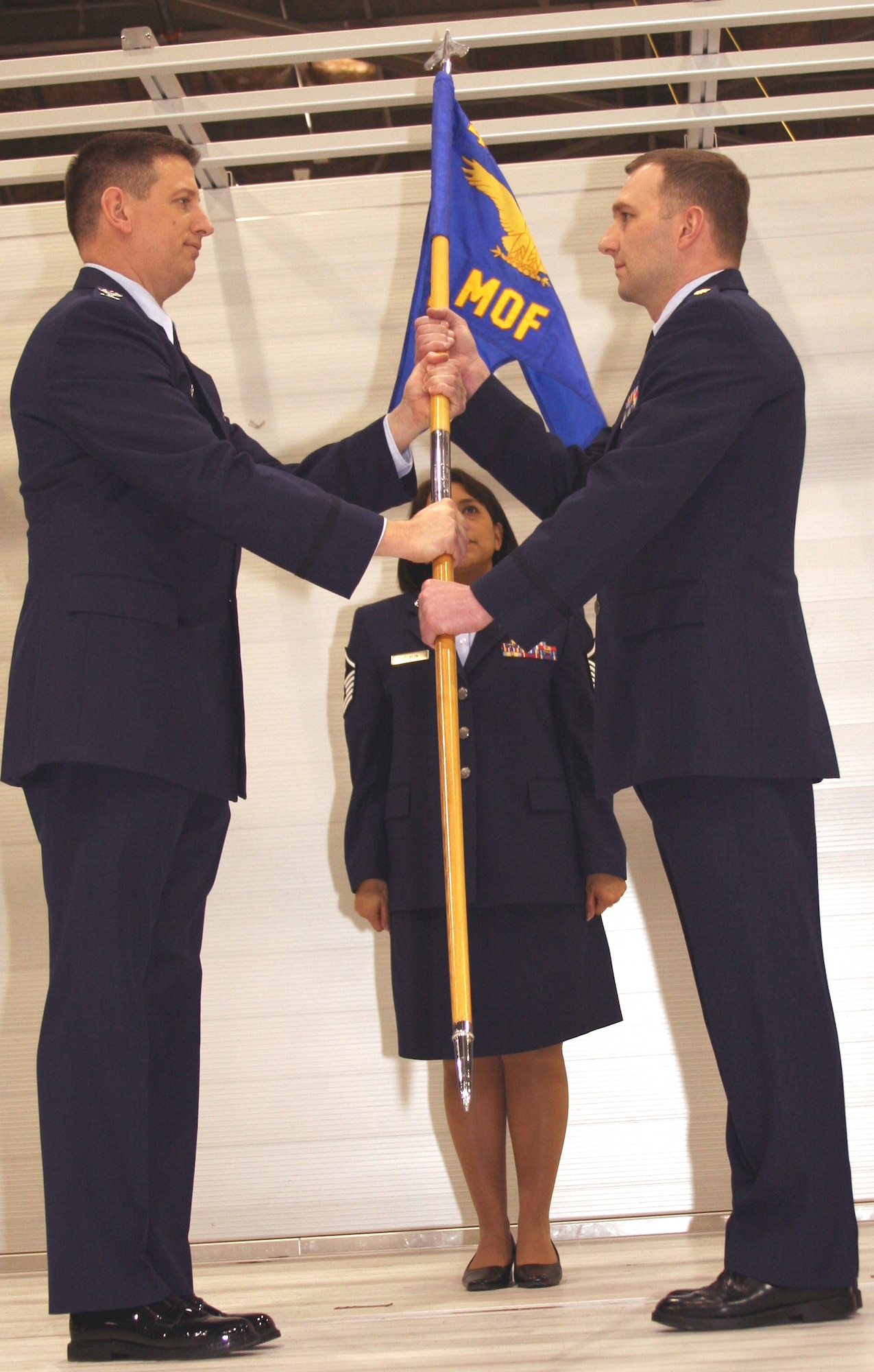 GRISSOM AIR RESERVE BASE, Ind. -- Col. Stan Sheley, 434th Maintenance Group commander, passes the 434th Maintenance Operations Flight flag to Maj. Michael Polomchak as he assumes command from Lt. Col. Arthur VanHouten during a special ceremony during the March unit training assembly. (Air Force photo/SrA. Omar Delacruz)