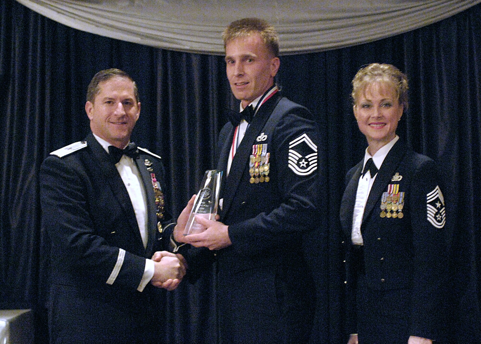 Senior NCO of the Year, Senior Master Sgt. Larry Blume, 49th Civil Engineer Squadron.