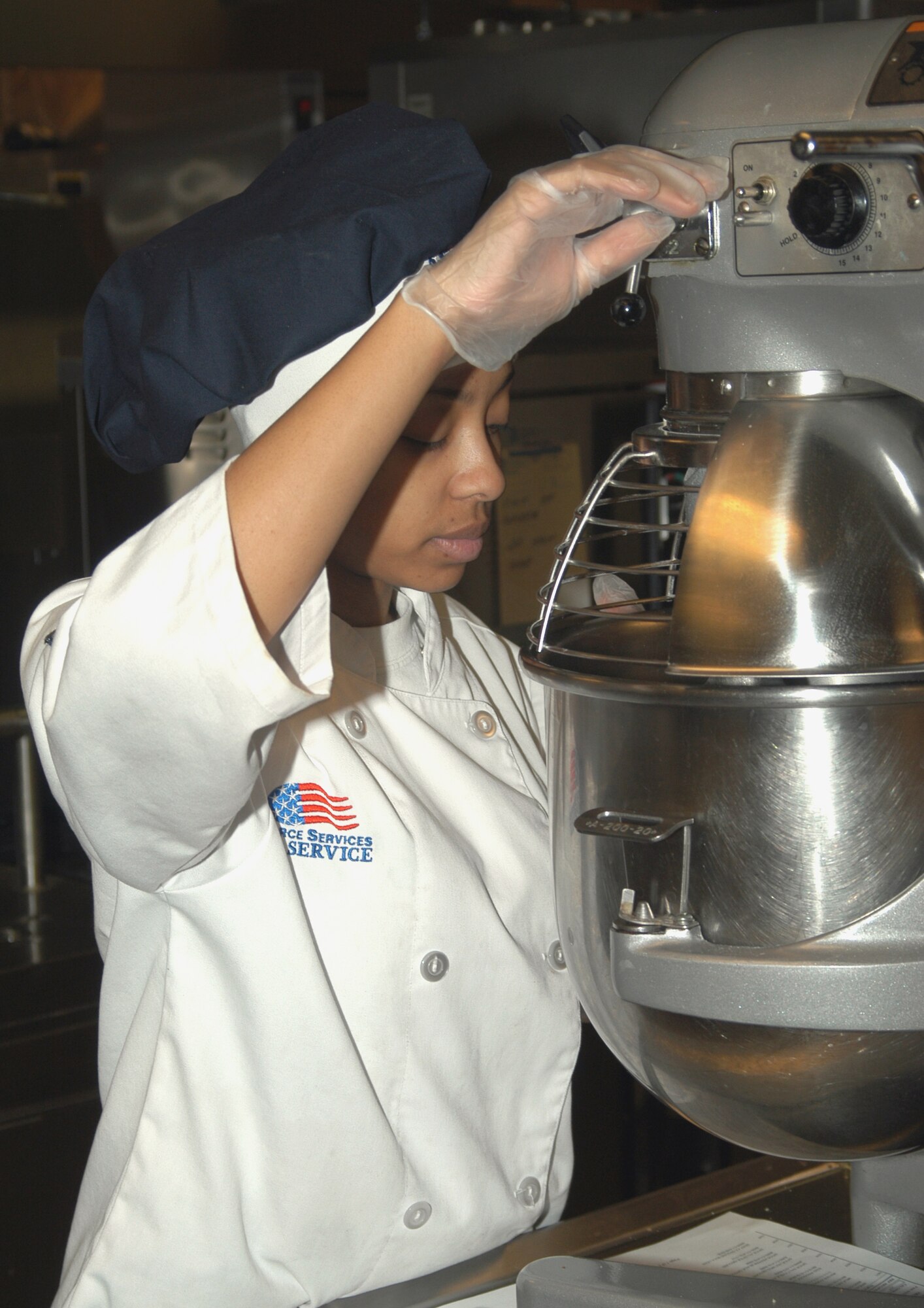 GRISSOM AIR RESERVE BASE, Ind .-- Staff Sgt. April Harper of 434th Services Flight,  adjusts a high volume mixer while preparing breakfast during a recent unit training assembly. (U.S. Air Force photo/Senior Airman Chris Bolen) 