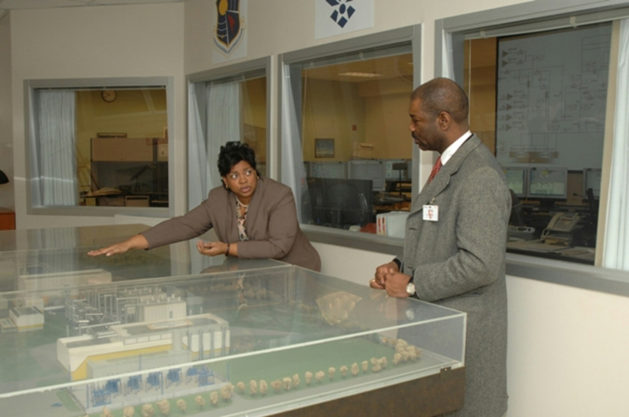 Raquel March explains the role of the Aeropropulsion Systems Test Facility at Arnold Engineering Development Center, Arnold Air Force Base, Tenn., to Neville Thompson during his tour of the base Feb. 23. Mr. Thompson, a senior engineer in the office of the deputy assistant Sscretary of the Air Force (Science, Technology and Engineering), was the guest speaker at AEDC’s annual African American Heritage luncheon held at the Arnold Lakeside Club Feb. 23.