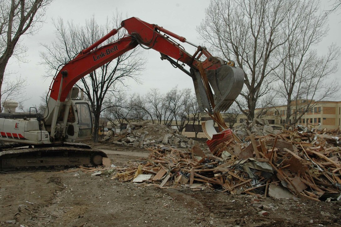 Construction workers start the Phase 4 and 5 housing construction process at Ellsworth by demolishing current housing no longer in use. The construction is slated to be completed by Oct. 2008. The Phase 4 housing is for senior ranking officers, chief master sergeants, company grade officers, senior non-commissioned officers and a few junior non-commissioned officers. The Phase 5 housing is for junior non-commissioned officers only. The $32.4 million contract was awarded to a local contracting company. (U.S. Air Force photo/Airman Nathan Riley)