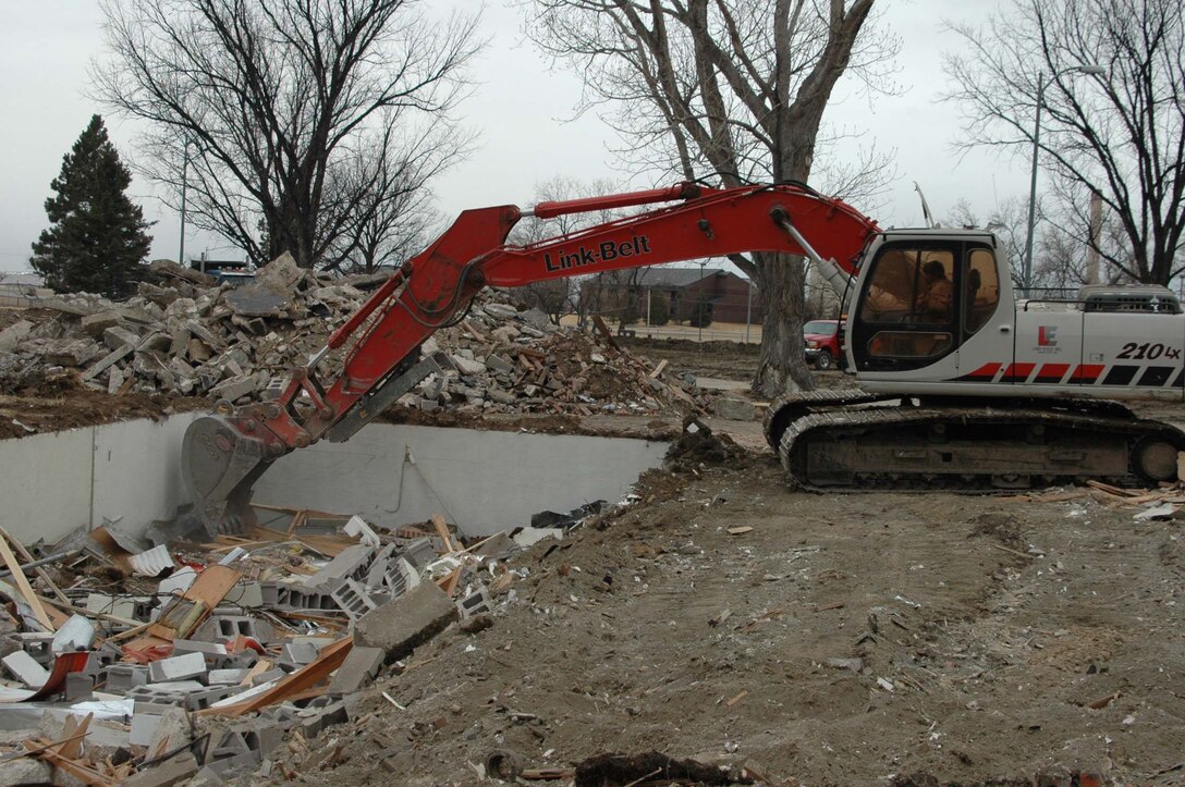 Construction workers start the Phase 4 and 5 housing construction process at Ellsworth by demolishing current unused housing. The construction is slated to be complete by Oct. 2008. The Phase 4 housing is for senior ranking officers, chief master sergeants, company grade officers, senior non-commissioned officers and a few junior non-commissioned officers. The Phase 5 housing is for junior non-commissioned officers only. The $32.4 million contract was awarded to a local contracting company. (U.S. Air Force photo/Airman Nathan Riley)