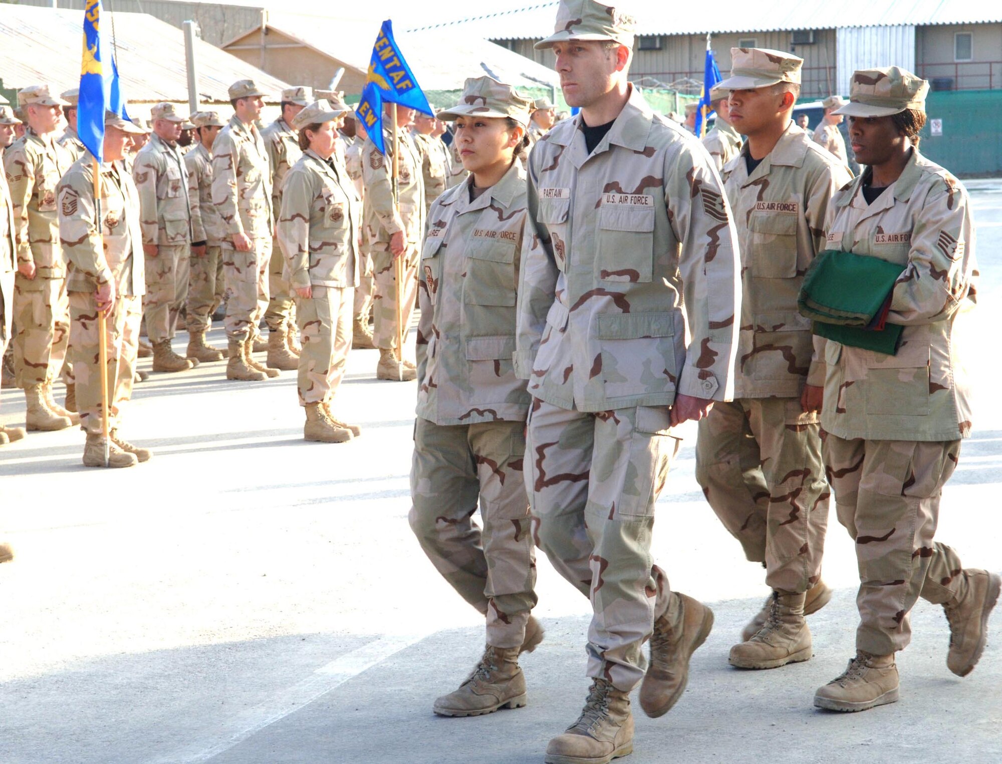 An honor guard from the 455th Air Expeditionary Wing retires the Afghanistan flag during a formal retreat ceremony at Bagram Airfield March 4. (U.S. Air Force photo/Capt. Travis B. Tougaw)