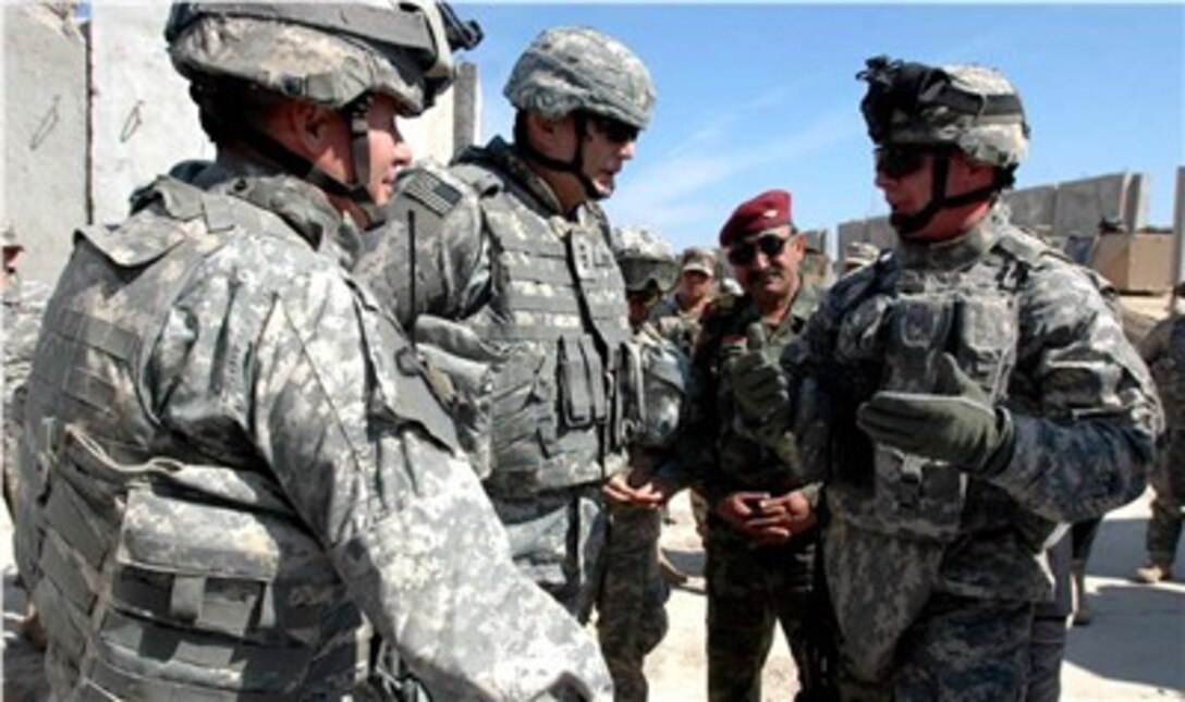 Col. Michael Kershaw, commander of the 2nd Brigade, 10th Mountain Division; Lt. Gen. Ray Odierno, commander of Multi-National Corps - Iraq; Lt. Col. Iman Ibrahim Mansour, commander of the 4th Battalion, 4th Brigade, 6th Iraqi Army Division and Lt. Col. Michael Infanti, commander of the 4th Battalion, 31st Infantry Regiment, discuss joint security operations at Forward Operating Base Yusifiyah, Iraq, March 4, 2007. 