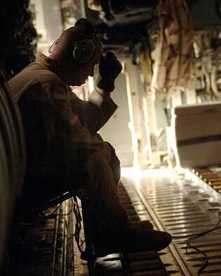 Master Sgt. Jim Read, a C-130 Hercules loadmaster, mentally prepares himself for his first warning leaflet airdrop mission March 6 over the southeastern mountains of Afghanistan. The leaflet airdrop mission is contributing to Operation Achilles, launched by International Security Assistance Force, to create an environment that will enable the government of Afghanistan to help improve security and the Afghan people's quality of life. (U.S. Air Force photo/Tech. Sgt. Cecilio Ricardo) 
