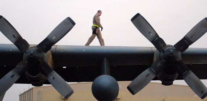 Staff Sgt. Jeremy Fraser a C-130 Hercules flight chief engineer, performs a preflight check March 6 in preparation for a warning leaflet airdrop over the Afghanistan. The leaflet airdrop mission is contributing to Operation Achilles, launched by International Security Assistance Force, to create an environment that will enable the government of Afghanistan to help improve security and the Afghan people's quality of life. (U.S. Air Force photo/Tech. Sgt. Cecilio Ricardo) 