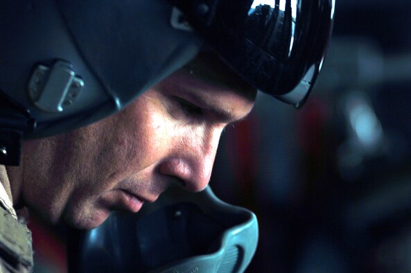Technical Sgt. Aaron Fletcher, C-130 Hercules loadmaster, concentrates on preparations to drop 30,000 warning leaflets March 6 over the southeastern mountains of Afghanistan. The leaflets were used to communicate with Taliban extremists, warning them not to interfere with coalition activities. The leaflet airdrop mission is contributing to Operation Achilles, launched March 6 by International Security Assistance Force. (U.S. Air Force photo/Tech. Sgt. Cecilio Ricardo) 