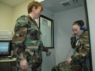 Master Sgt. Michelle Rootes and Airman 1st Class Christina Moran, both from the 5th Medical Operations Squadron, perform a routine inspection of a hearing booth at the 5th Medical Group. Sergeant Rootes recently won two Air Force level awards. Sergeant Rootes was awarded the 2006 Col. Cleveland L. Parker Award - Public Health Senior NCO of the Year and was a member of the Air Force Expeditionary Medics, who were named as the 2007 Air Force Team of the Year. (U.S. Air Force photo by Senior Airman Danny Monahan)