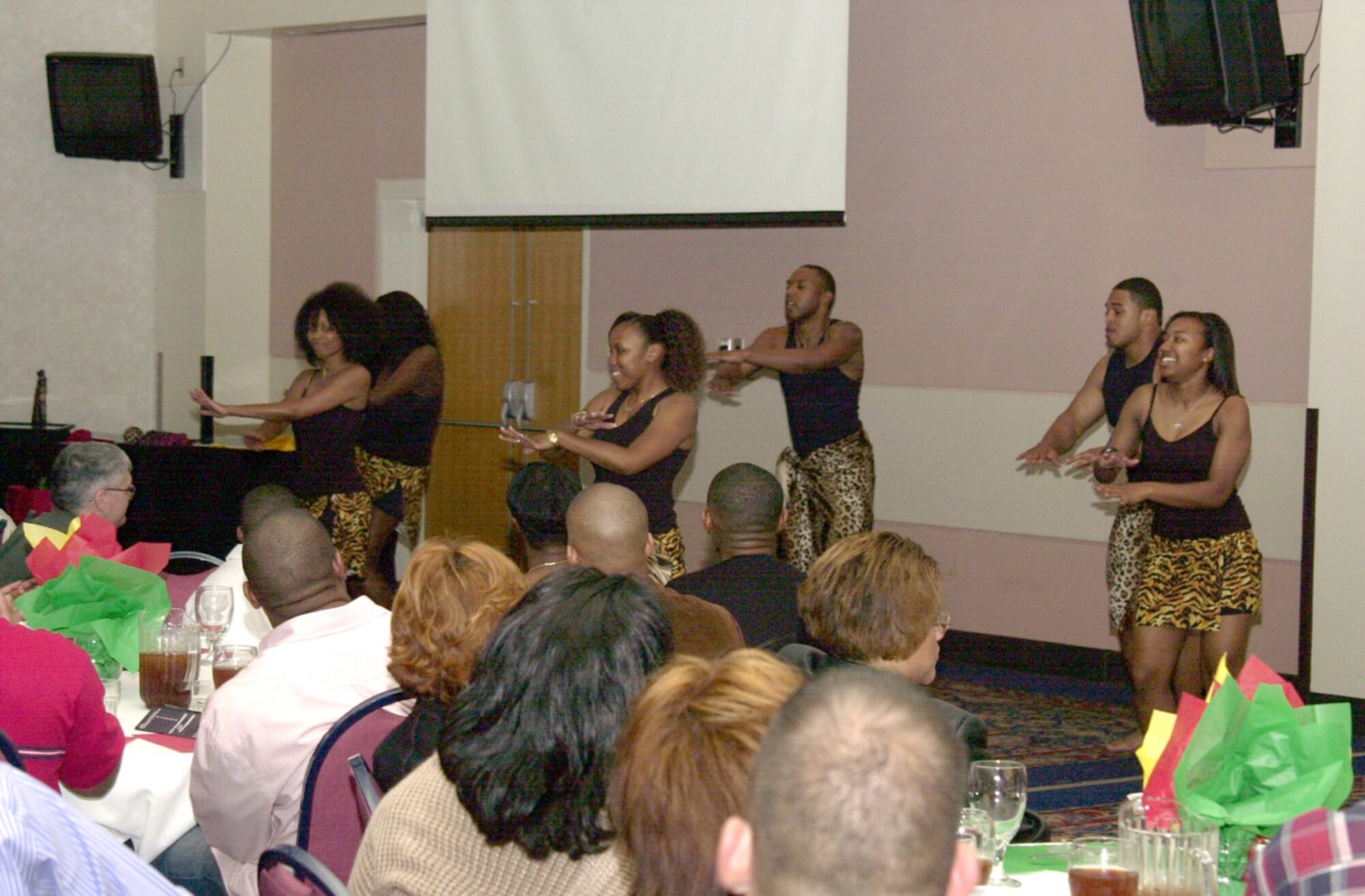 Dancers at the African American Heritage Committee’s 2007 Black History Month Special Event perform their dancing talents by performing a traditional African tribal dance February 23 at the Events Center. The event’s theme was “An Evening to Remember -- Celebrating Black History Month Together.” (U.S. Air Force photo by Airman 1st Class Luis Loza Gutierrez)