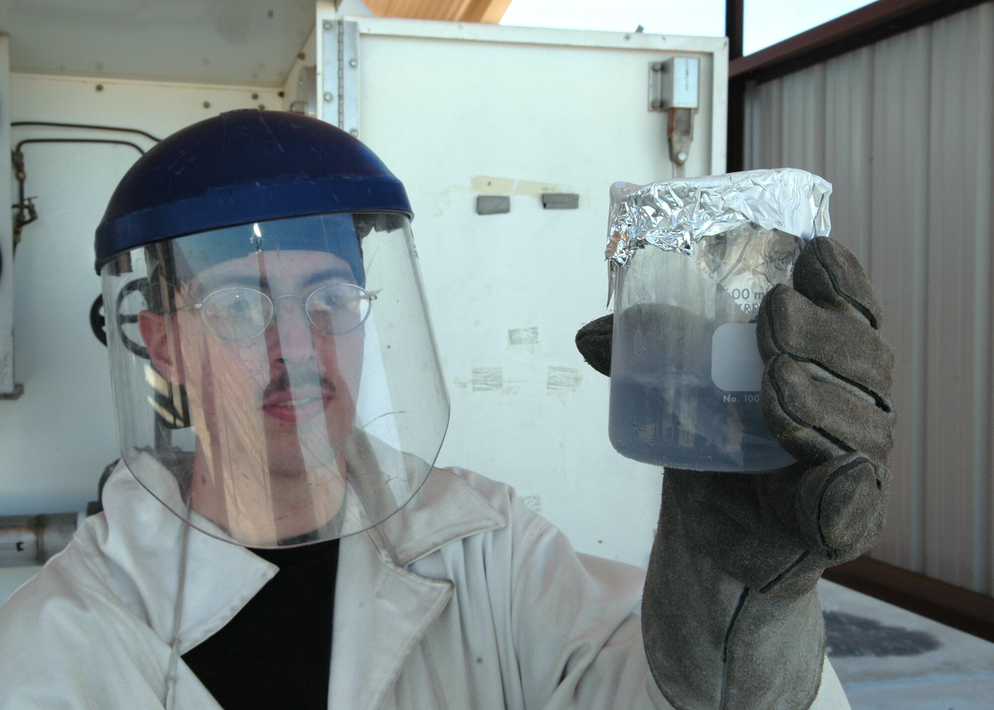 Senior Airman Steven Dessino, 49th Logistics Readiness Squadron, checks a sample of LOX (liquid oxygen) for particulate odor. (U.S. Air Force photo by Airman Jamal Sutter)