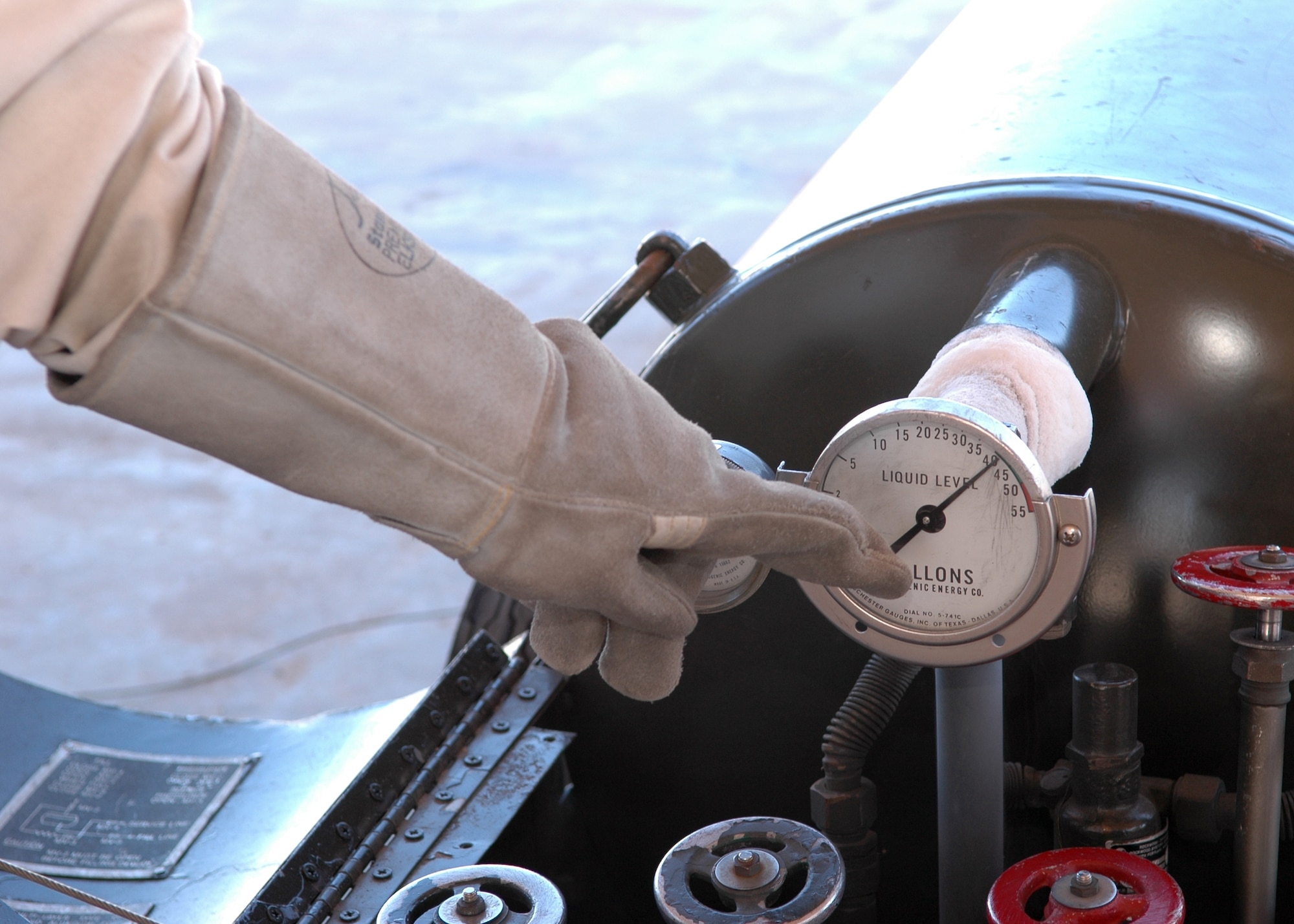 Mr. Antonio Biancaniello, 49 Logistics Readiness Squadron, checks the liquid level gauge of the LOX (liquid oxygen) tank  March 6. The max amount of liquid oxygen that the tanks can hold is 50 gallons. (U.S. Air Force photo by Airman Jamal Sutter)