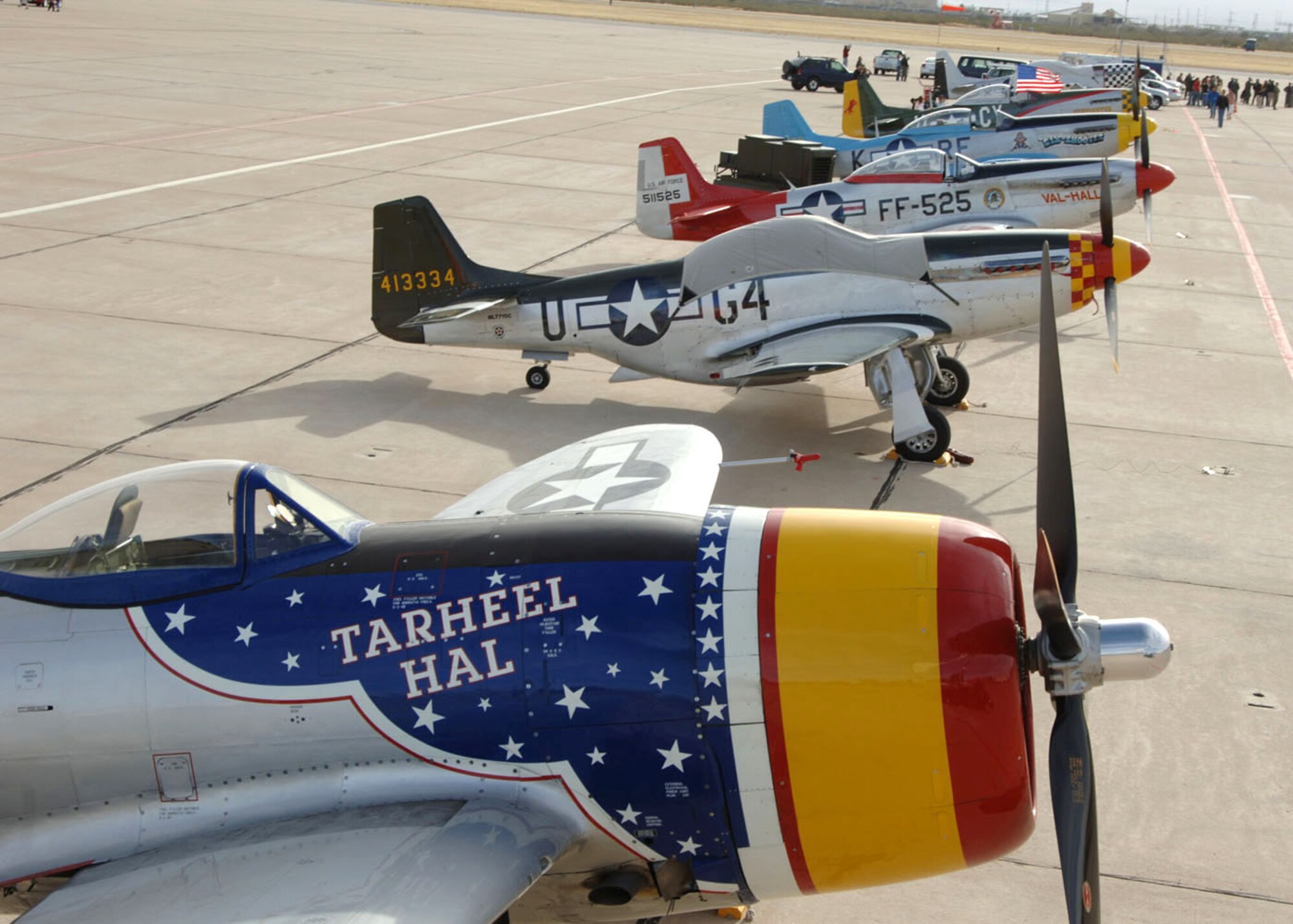 A P-47 Thunderbolt and several P-51 Mustangs rest on the Davis-Monthan Air Force Base, Ariz., ramp March 4 after a busy few days at the 2007 Heritage Conference there.  The conference provided an opportunity for Air Combat Command demonstration pilots to train together with modern and historic military aircraft in preparation for the upcoming air-show season.  (U.S. Air Force photo/Staff Sgt. Lanie McNeal)