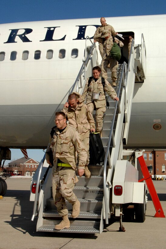 Airmen of the 127th Wing arrive March 5 at Selfridge Air National Guard Base in Michigan as they return from a deployment to Balad Air Base, Iraq. About 200 Airmen returned to frigid temperatures of Michigan and a crowd of about 200 family members and friends. (U.S. Air Force photo/John S. Swanson) 
