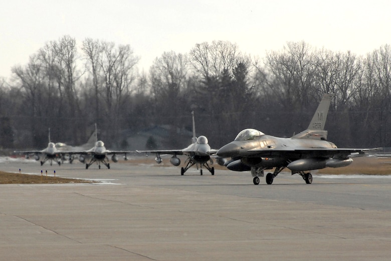 Twelve F-16 Fighting Falcons from the 127th Wing returned March 2 to Selfridge Air National Guard Base in Michigan after serving in support of Operation Iraqi Freedom. Approximately 250 members of the Michigan Air National Guard's 127th Wing were deployed to Balad Air Base, Iraq. (U.S. Air Force photo/John S. Swanson)