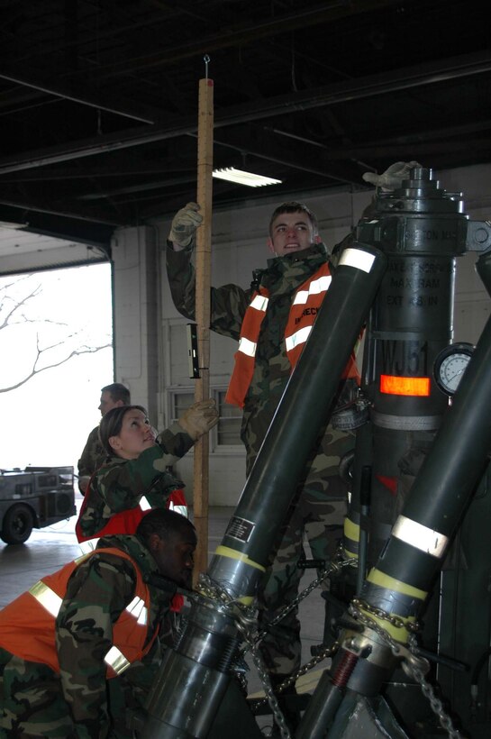 Airmen 1st Class Erendira Schroeder and David Greene, 28th Logistics Readiness Squadron, measure the height of cargo pallets at the deployment processing center at Ellsworth Air Force Base, S.D., March 5. Ellsworth Airmen will move 272 tons of cargo and 451 passengers during the Badlands Express Phase 1 Operational Readiness Exercise 07-03. The exercise is scheduled to conclude March 7. (U.S. Air Force photo/Senior Airman Josh Moshier)
