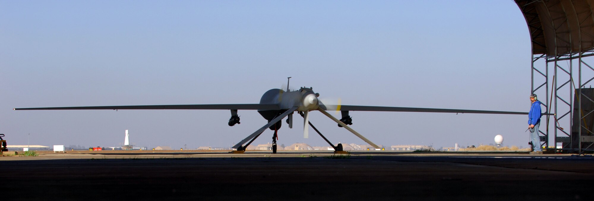 Bruce Ottenwess conducts pre-flight checks before launching the  MQ-1 Predator Unmanned Aerial Vehicle Jan. 31 from Balad Air Base, Iraq. Mr. Ottenwess is a General Atomics Aeronautical Systems Airframe and power plant mechanic based out of Creech Air Force Base, Nev. (U.S. Air Force photo/Staff Sgt. Michael R. Holzworth) 