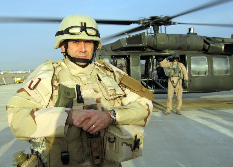 BALAD AIR BASE, Iraq -- Chaplain (Capt.) Dave DePinho prepares to board a UH-60 Blackhawk helicopter on his way to a forward operating location in Iraq. The wing's chaplains are responsible for offering spiritual care to Airmen assigned here 	and to forward locations wherever they may be. They are accompanied by chaplain assistants who provide protection and security, as well as ministry support for the chaplains who are considered non-combatants.