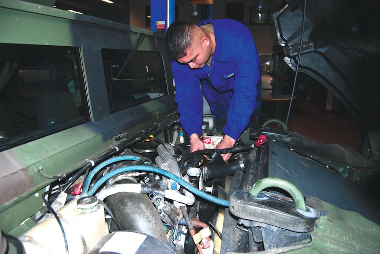 Staff Sgt. Fernando Mendiola, 52nd Logistics Readiness Squdron, a general purpose vehicle maintainer, replaces an alternator on a HUMVEE. The general purpose vehicle and vehicular equipment maintainers attend a 16-week long technical school at Port Hueneme, Calif. Upon completion,  they are equipped to maintain the majority of vehicles and vehicular equipment found on most Air Force bases throughout the world.  (US Air Force photo by Nick Anderson)