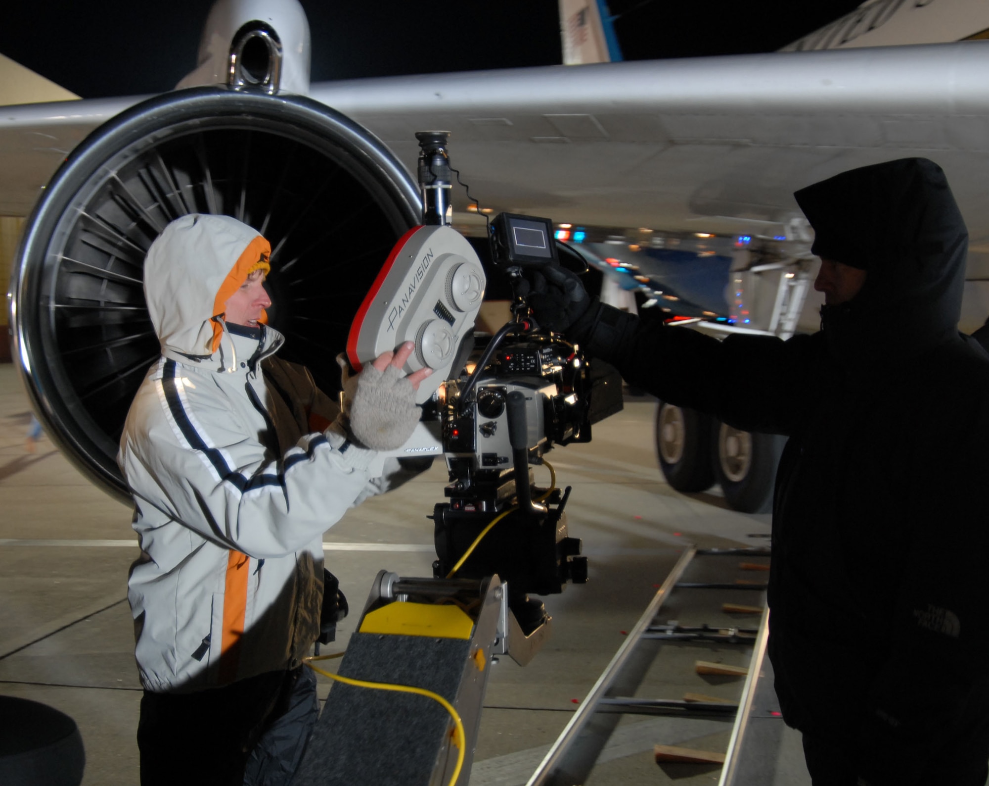 A loader and a camera assistant reload a camera's film between shots on the set of "Transformers" here Feb. 28, 2007. The film's crew returned to Edwards to shoot additional scenes for the movie's July 4 release. (Photo by 1st Lt. Brad Kimberly)