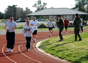 Air Force Reservists with the 940th Air Refueling Wing run 1.5 miles as part of their official fitness test March 4, 2007 at Beale Air Force Base, Calif.  The Air Force physical fitness assessment measures aerobic fitness, physical strength/endurance and body composition and helps ensure Airmen are "Fit to Fight." (U.S. Air Force photo/Stacey Knott)