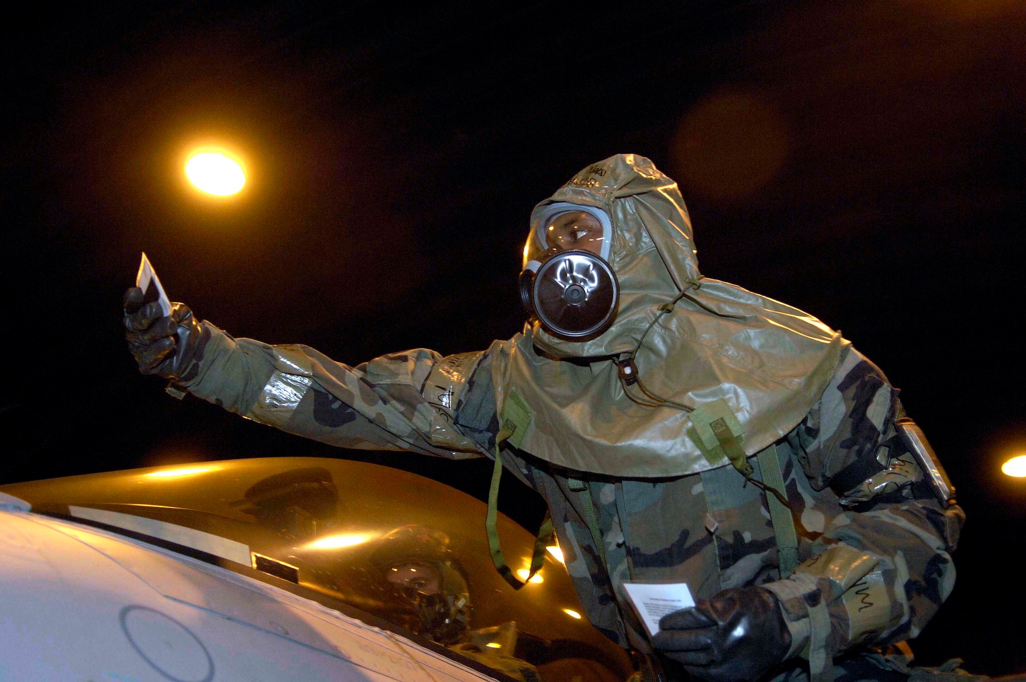 Staff Sgt Brandon Ward uses specially treated paper March 6 to detect chemical agents on an F-16 Fighting Falcon during a NATO Tactical Evaluation at Aviano Air Base, Italy.  The evaluation is to determine if Aviano's 31st Fighter Wing is prepared to support NATO Response Force 9/10.  (U.S. Air Force photo/Airman 1st Class Michael S. Dorus)