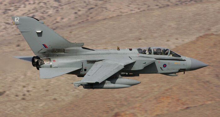 A Royal Air Force Tornado streaks across the desert near Rachel, Nev., at about 250 feet and 500 miles per hour during the Red Flag exercise in February 2007. F-111s from the Royal Australian Air Force also took part in the exercise, which trains aircrews in an extremely realistic combat environment. The photo was taken from Coyote Summit, near the east side of the Nevada Test and Training Range. (Photo courtesy Paul Ridgway)
