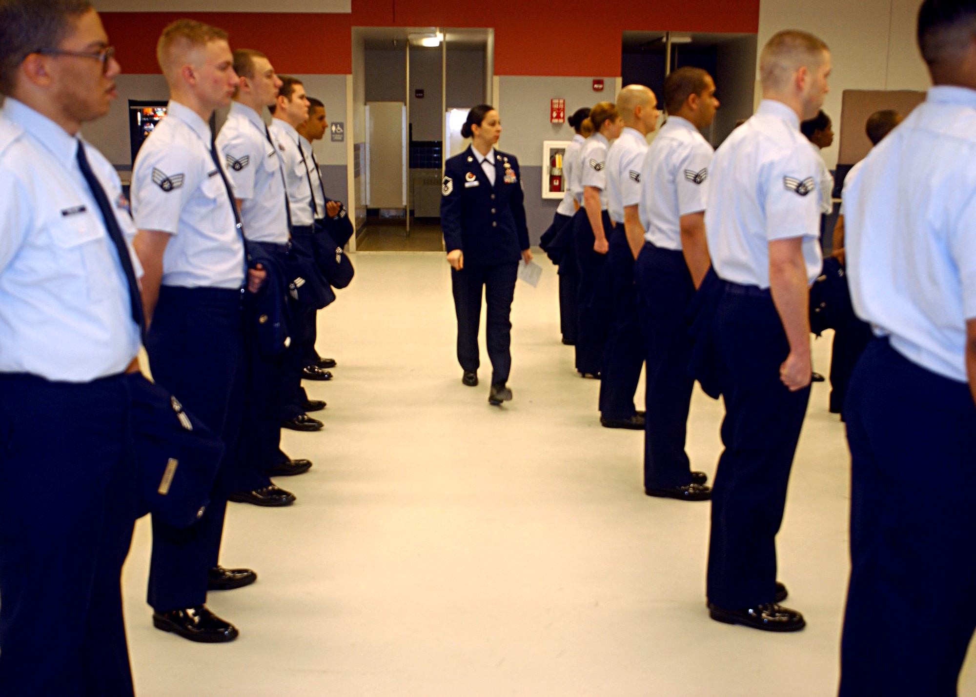 EIELSON AIR FORCE BASE, Alaska -- Master Sgt. Deanna Croxen, 354th Mission Support Squadron, walks between the first and second element during an open ranks inspection at the Joint Mobility Complex on Mar. 6. Airman Leadership School, is a mandatory course for Airmen transitioning to the rank of Staff Sergeant which teaches cores values, mentoring, and leadership skills. (U.S. Air Force photo by Airman 1st Class Jonathan Snyder)
