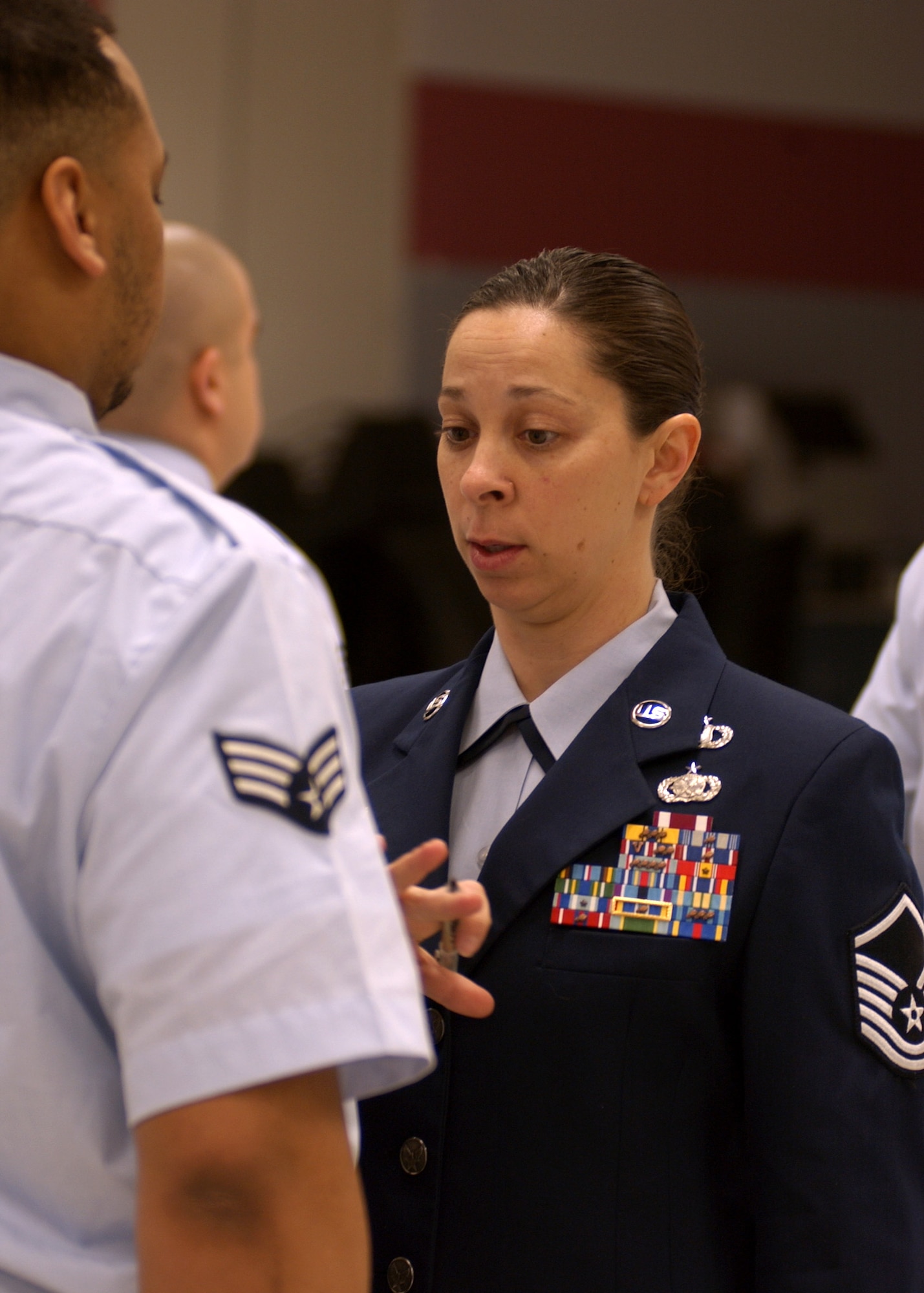 EIELSON AIR FORCE BASE, Alaska -- Master Sgt. Deanna Croxen, 354th Mission Support Squadron, inspects Senior Airman Vincent Colmes, 354th Aircraft Maintenance Squadron, during open ranks at the Joint Mobility Complex on Mar. 6. Airman Colmes is currently enrolled in Airman Leadership School, which teaches Airmen cores values, mentoring, and leadership skills for the transition to Staff Sergeant. (U.S. Air Force photo by Airman 1st Class Jonathan Snyder)